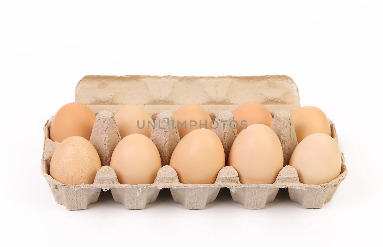 Ten brown eggs in a paper egg box.