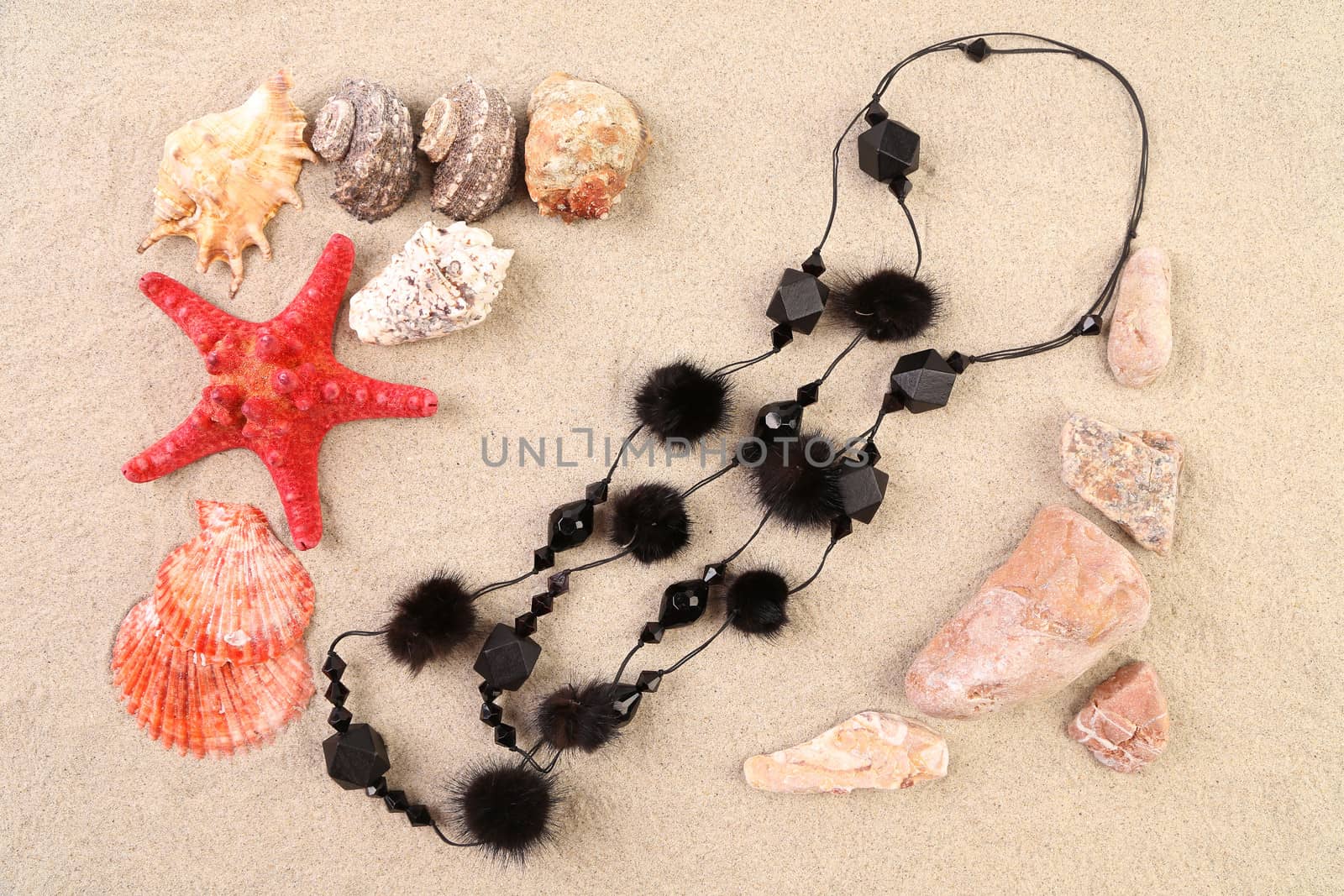 Summer concept - sand stones and seashells frame necklace