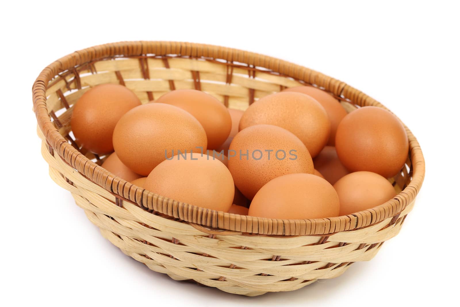 Some eggs in a big brown basket