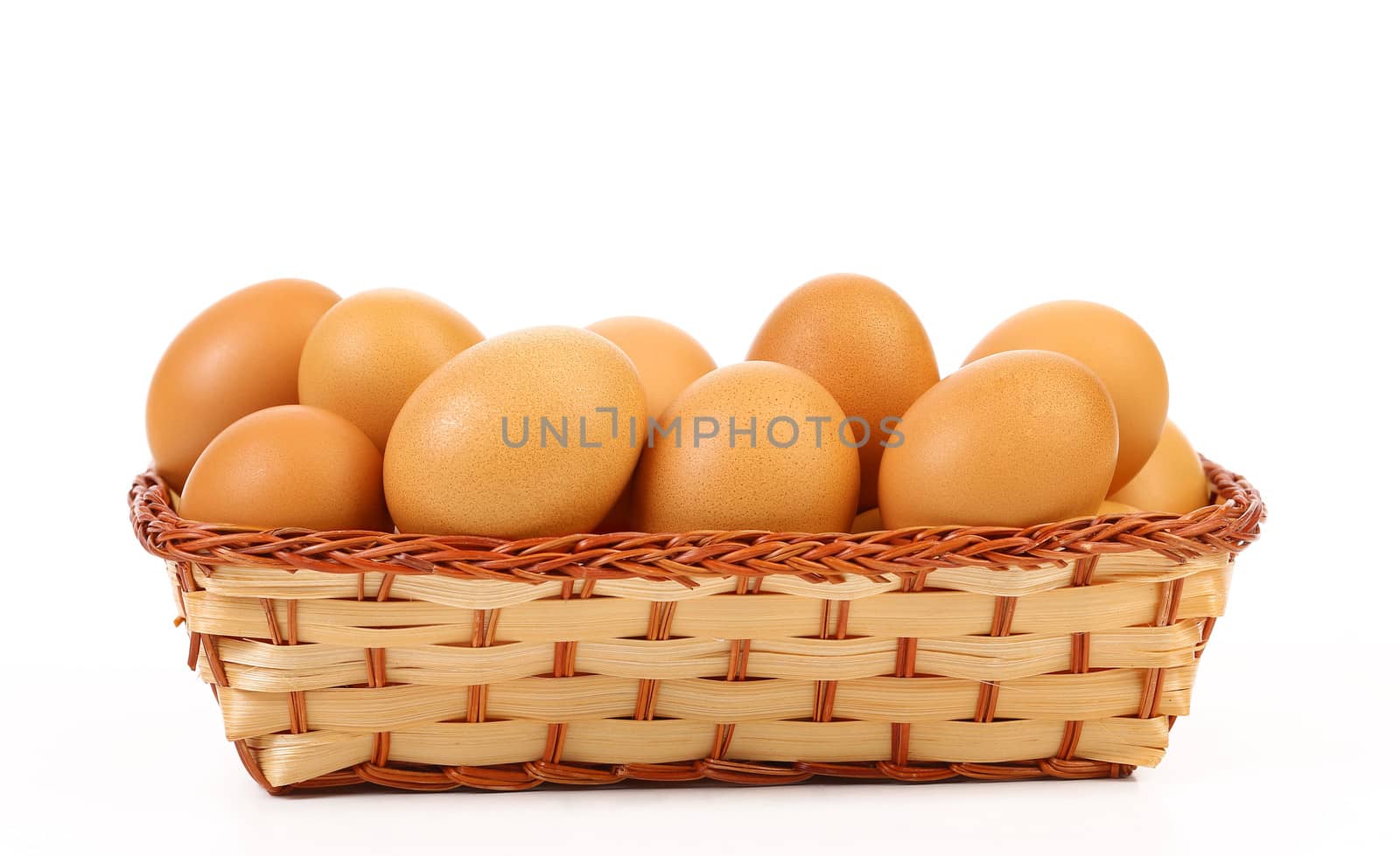 Full basket off eggs. In a white background