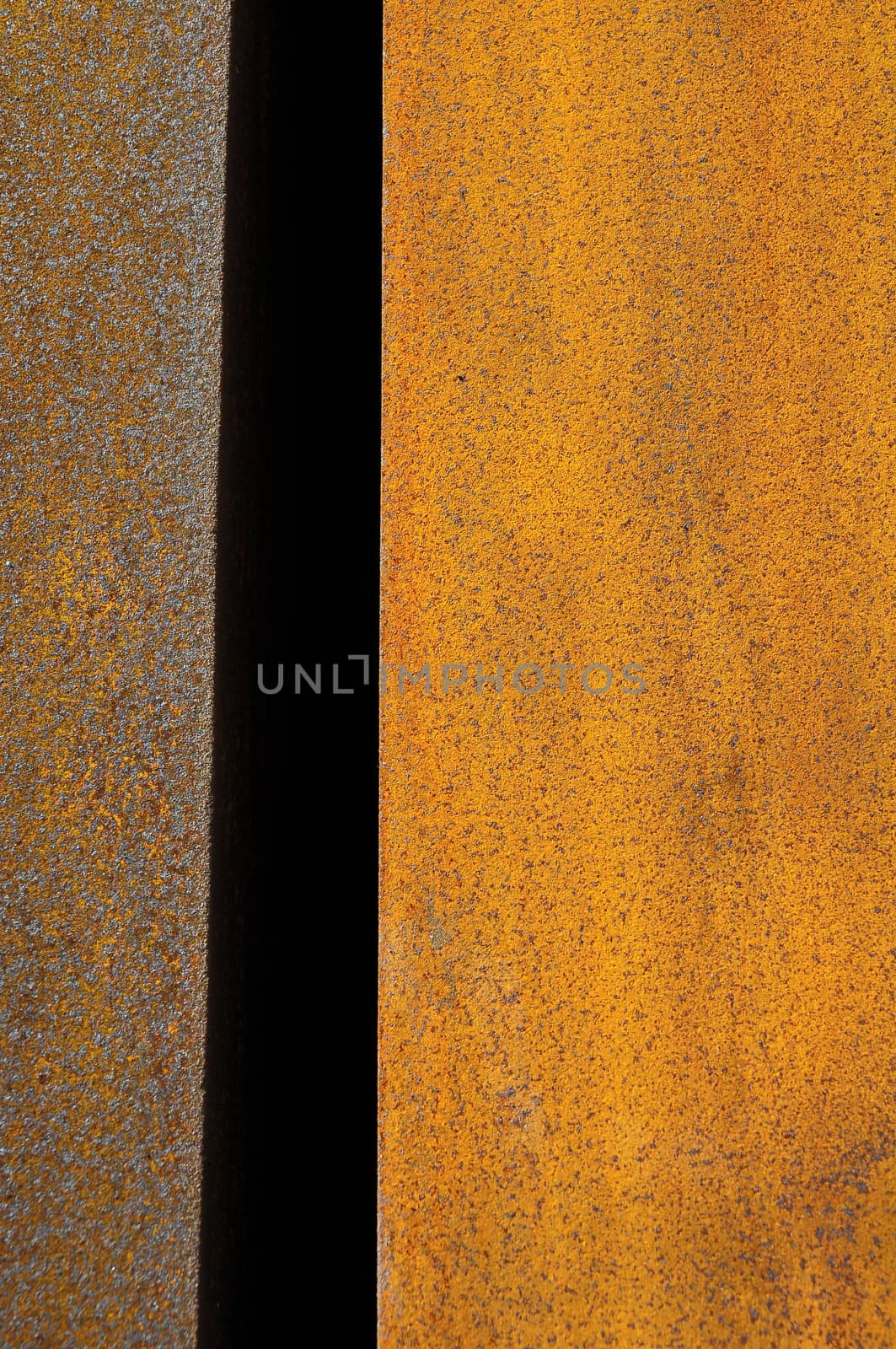 Orange Patterns on the Rusty Surface of the Metal