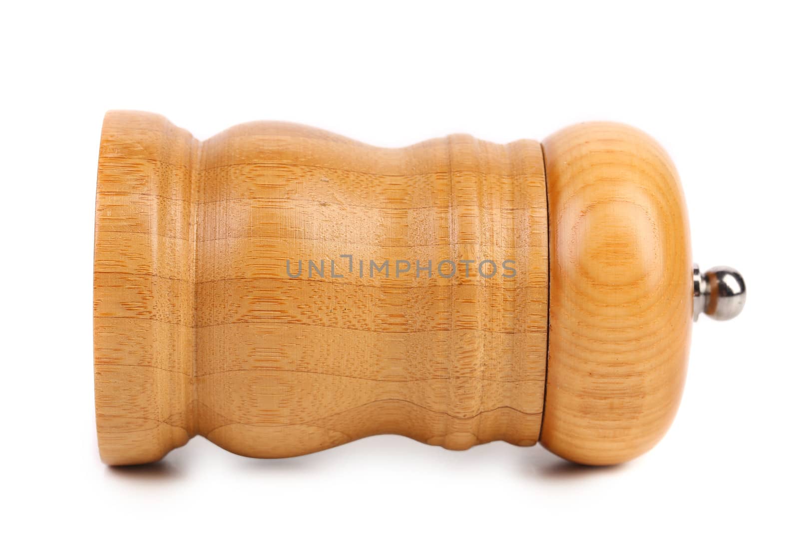 Wooden pepper or salt pot. On a white