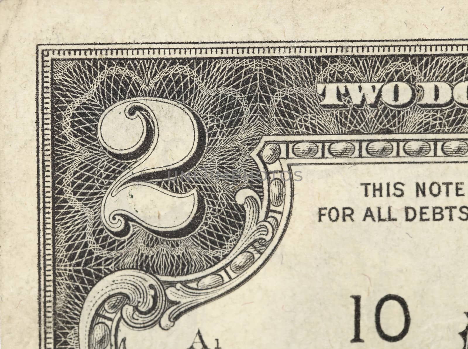 Two dollar bill close-up on a white background.