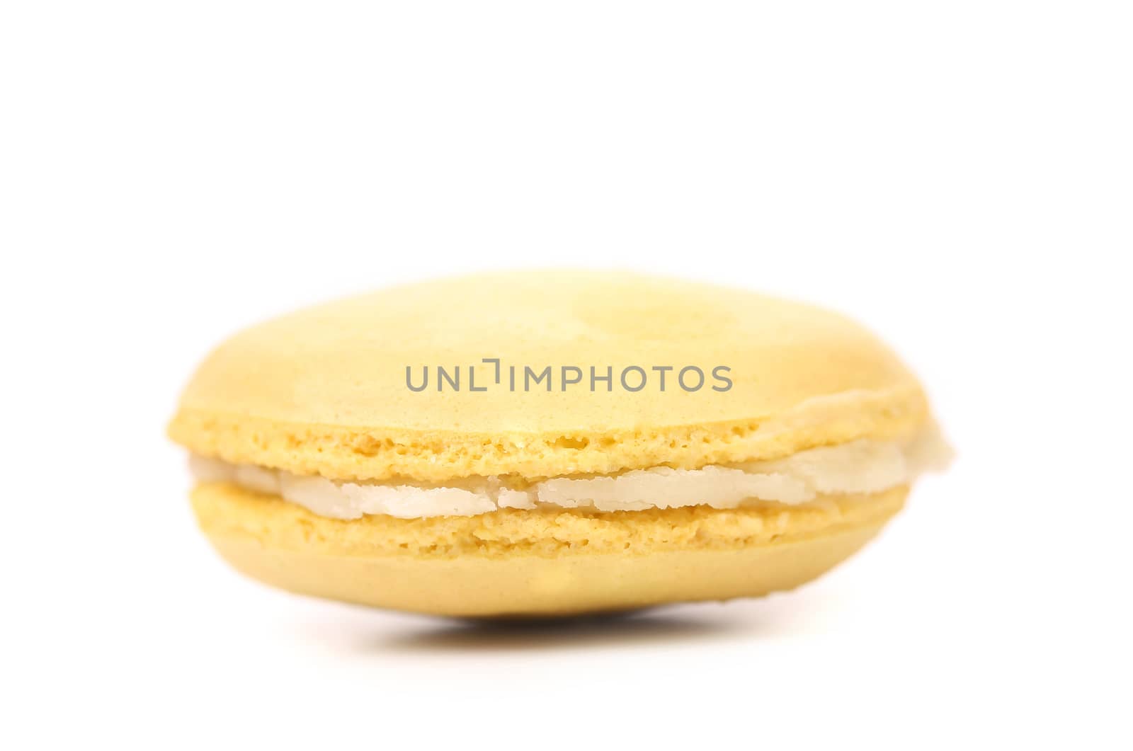 Yellow macaron cakes. Isolated on a white background.