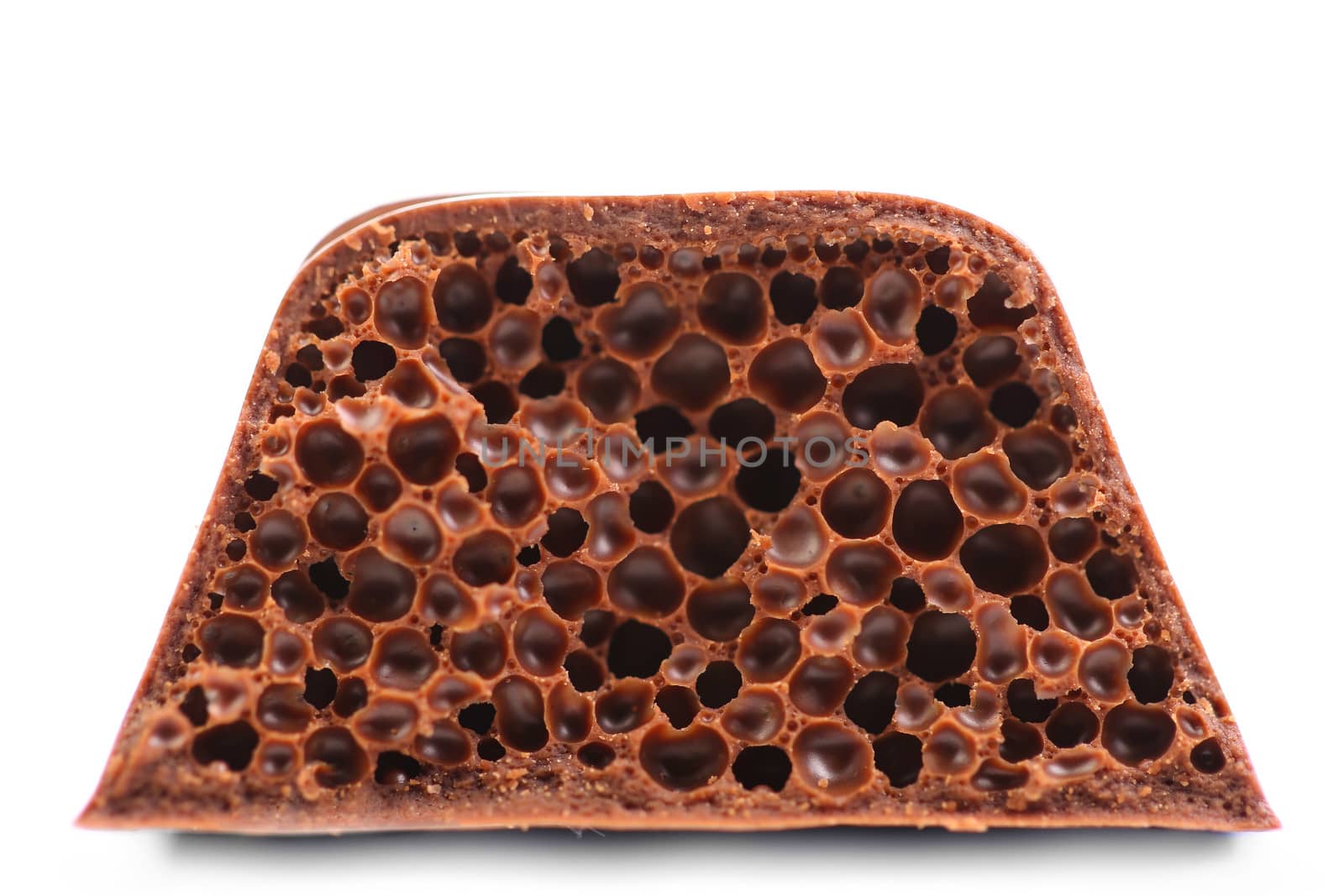 Air porous chocolate. Isolated on a white background.