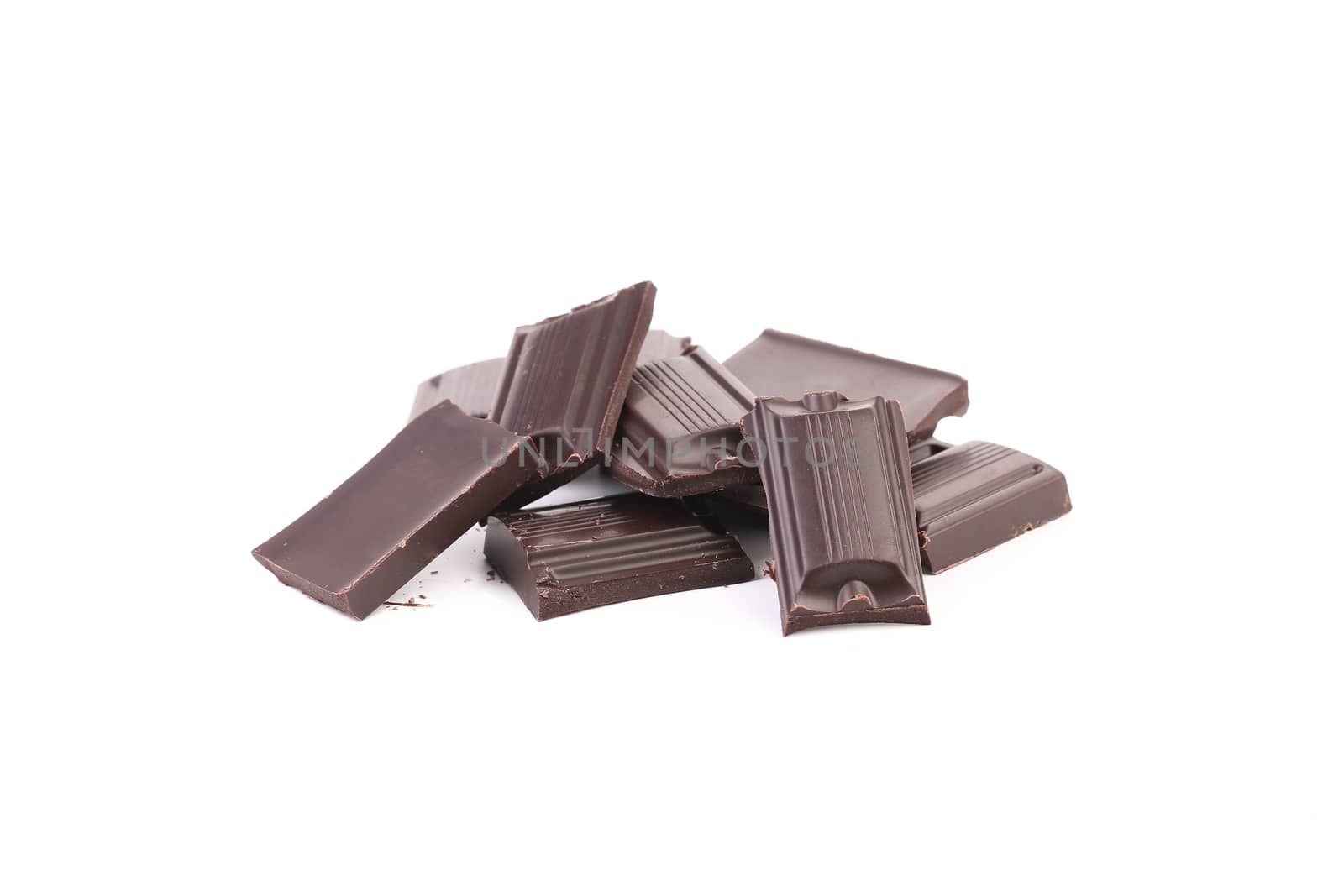 Tasty morsel of dark chocolate. Isolated on a white background.