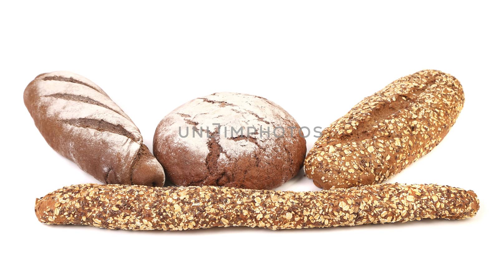 Different brown breads. Isolated on a white background.