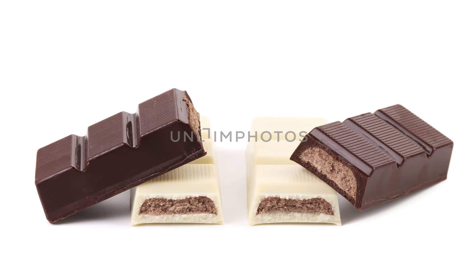 Black and white chocolate bars with filling. White background.