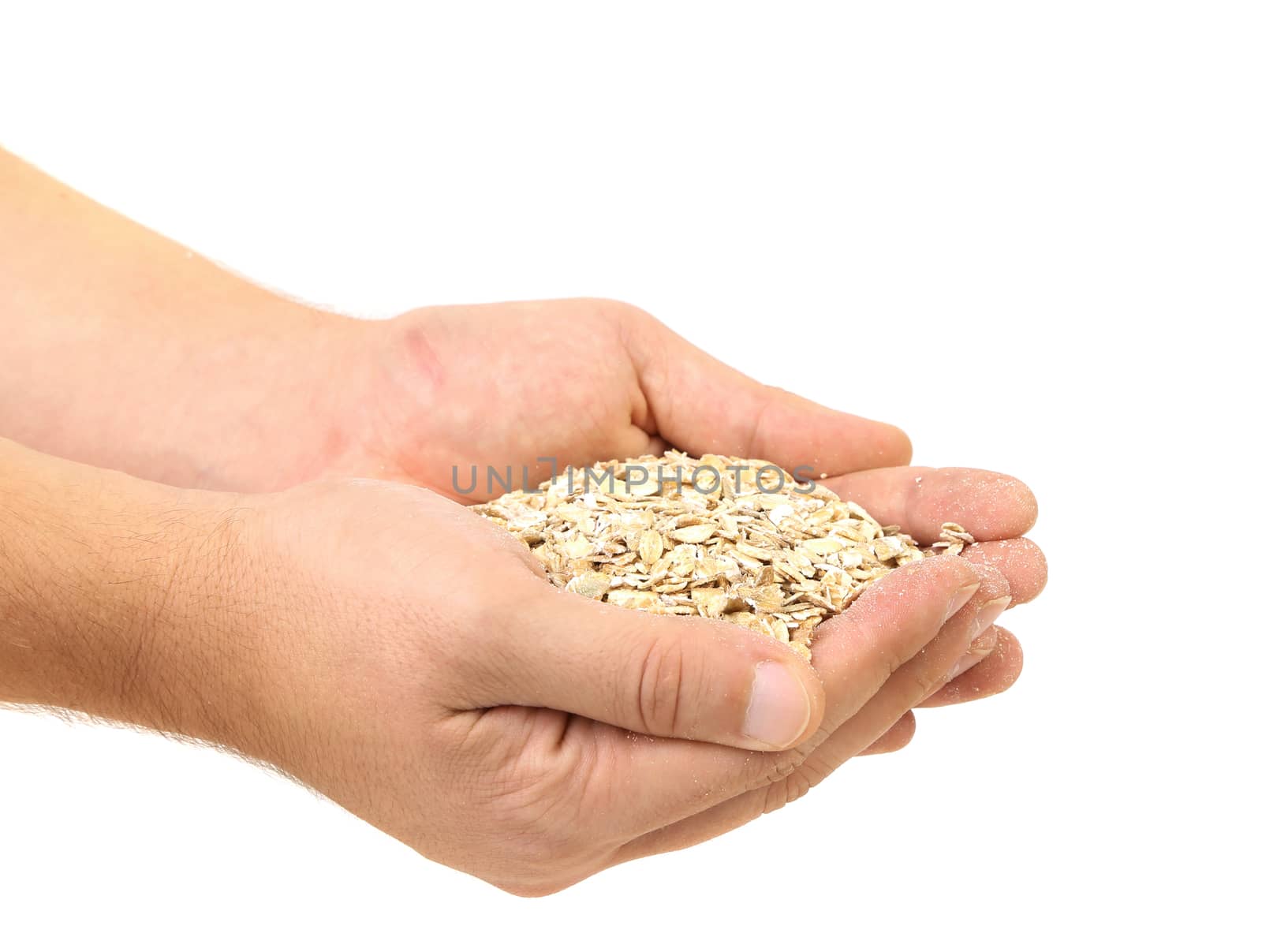Handful of oatmeal flakes. Isolated on a white background.