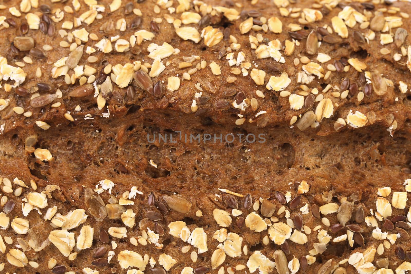 Background of grain brown bread. Whole background.