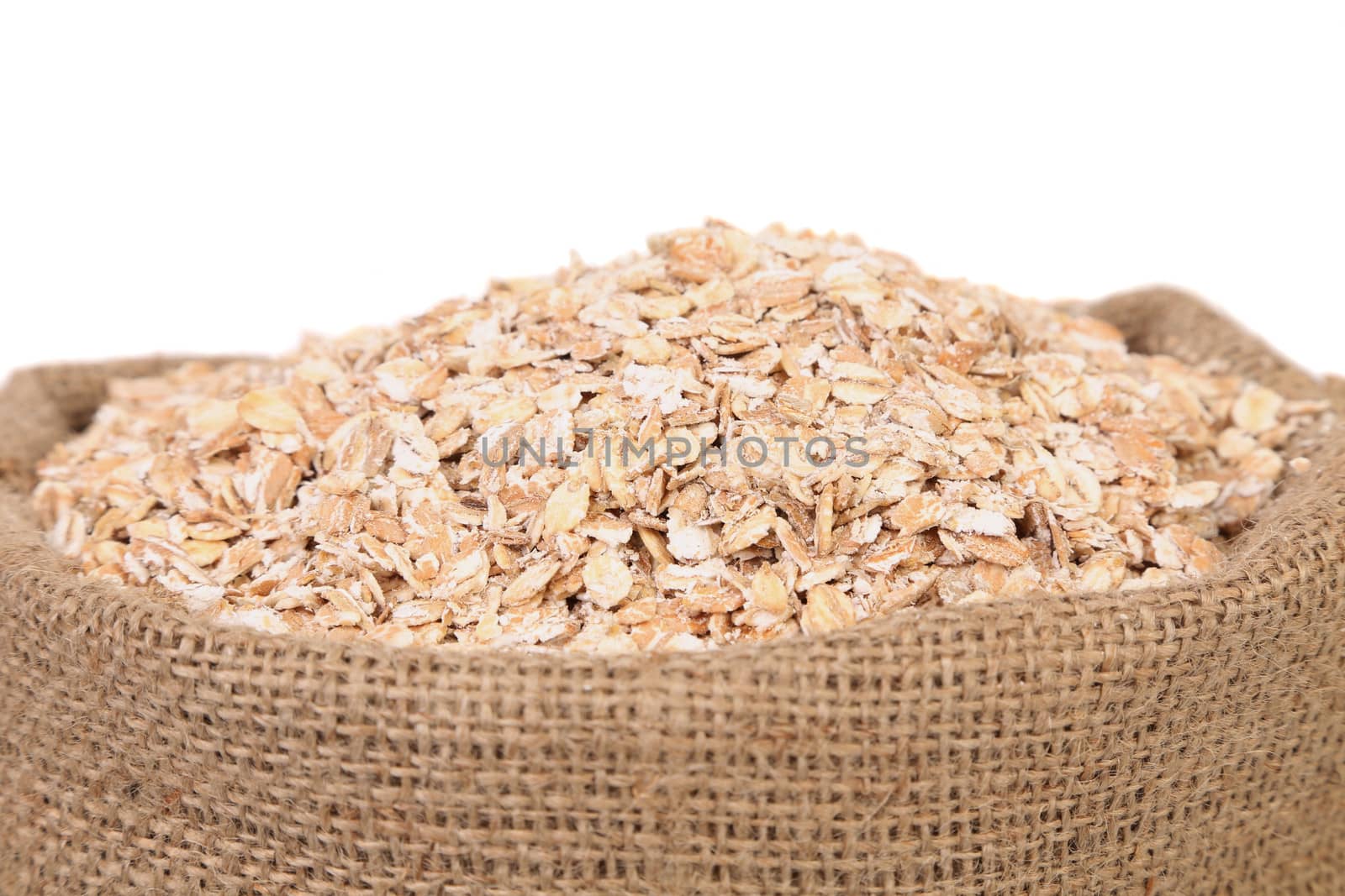 Bag of oatmeal flakes. Close up. There is space for text.