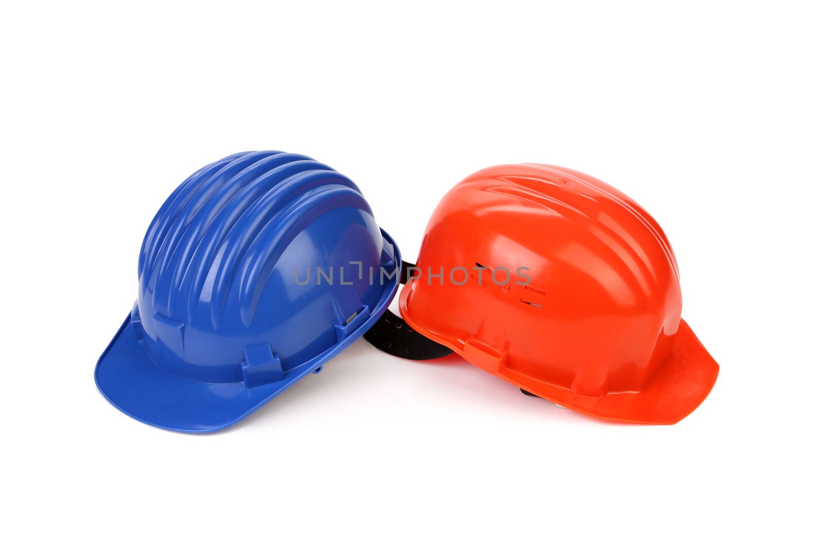 Hard hat of different colors like yin and yang. Isolated on a white background.