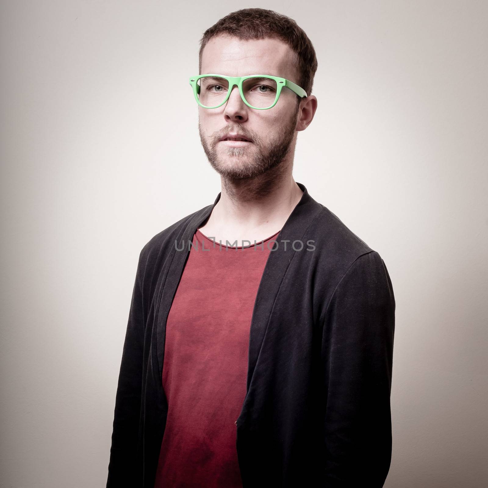 stylish hipster man portrait on gray background