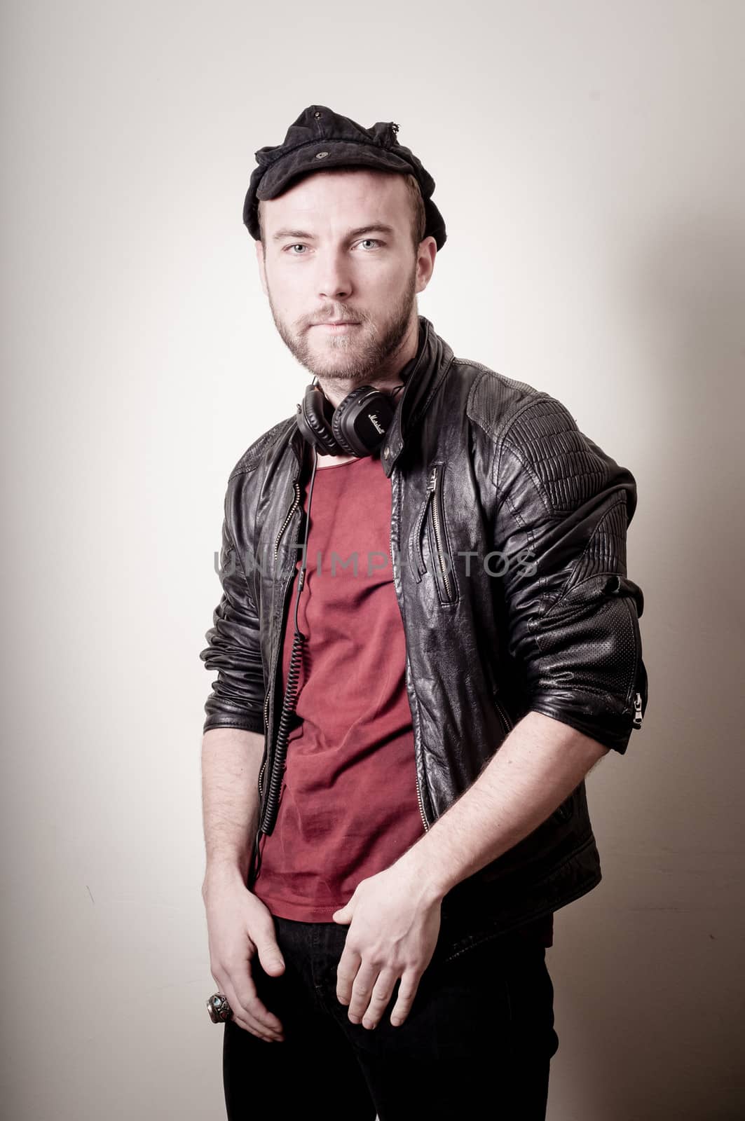stylish hipster man portrait on gray background