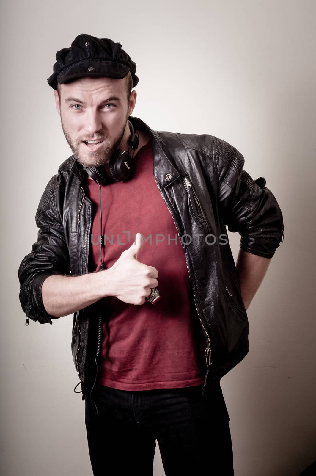 stylish hipster man portrait on gray background