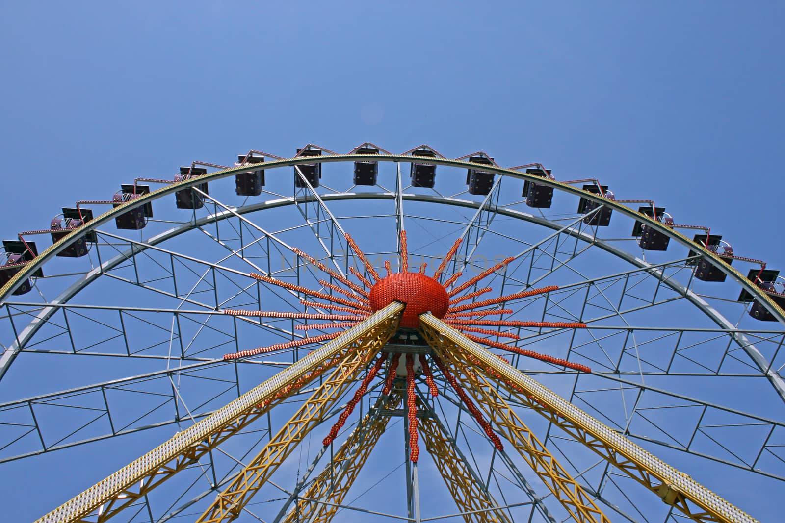 ferris wheel over blue sky