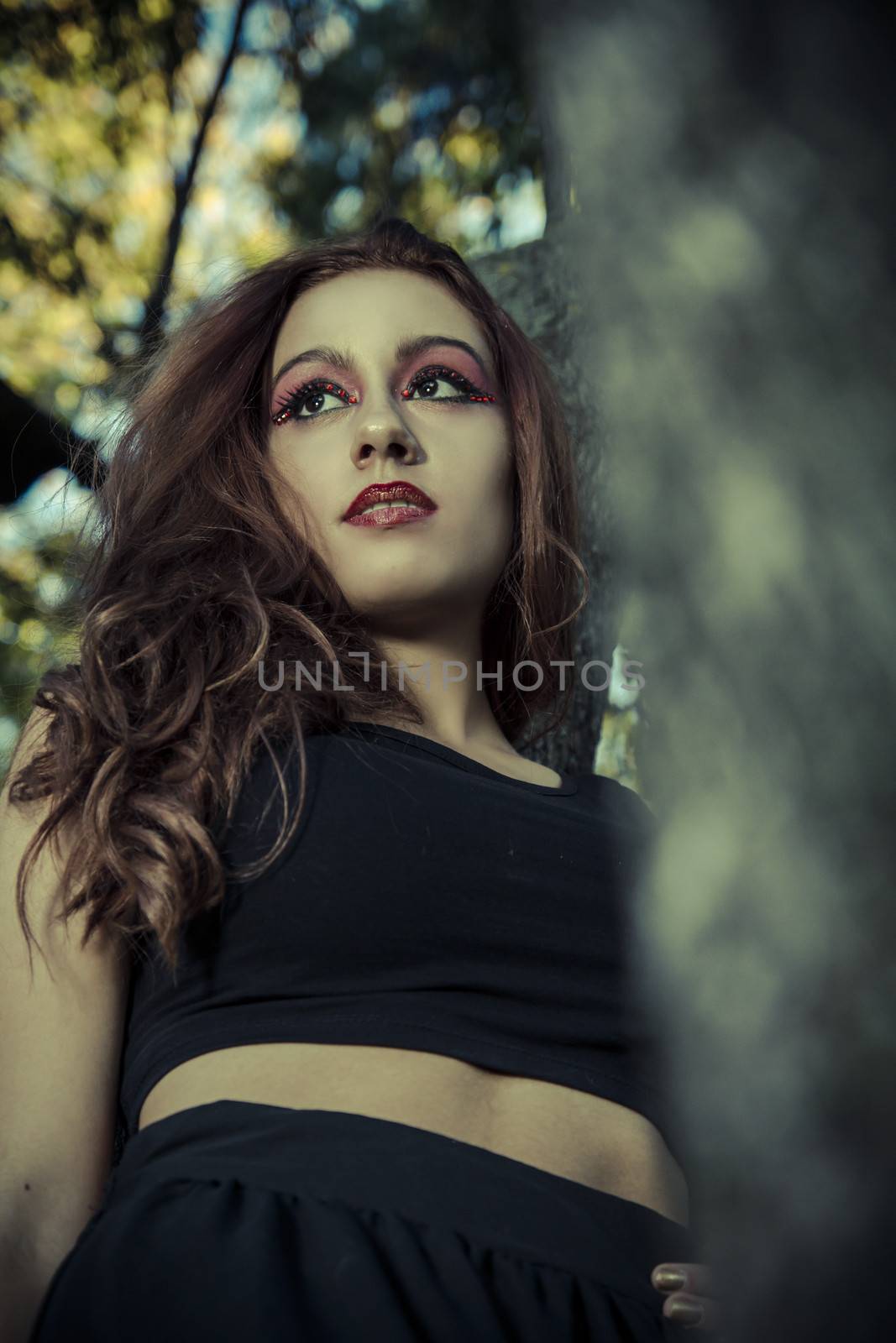 In the forest. Beautiful Teenage Model Dressed in Fashionable Sh by FernandoCortes