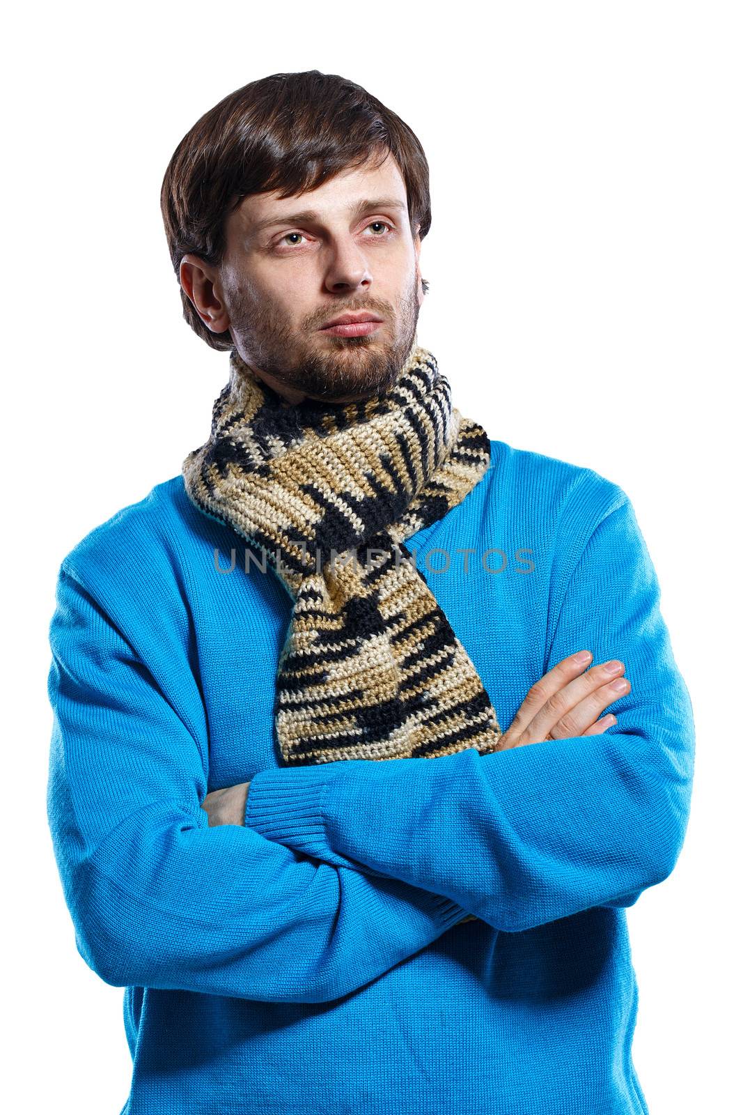Young man wearing a scarf and a sweater folded his arms across his chest