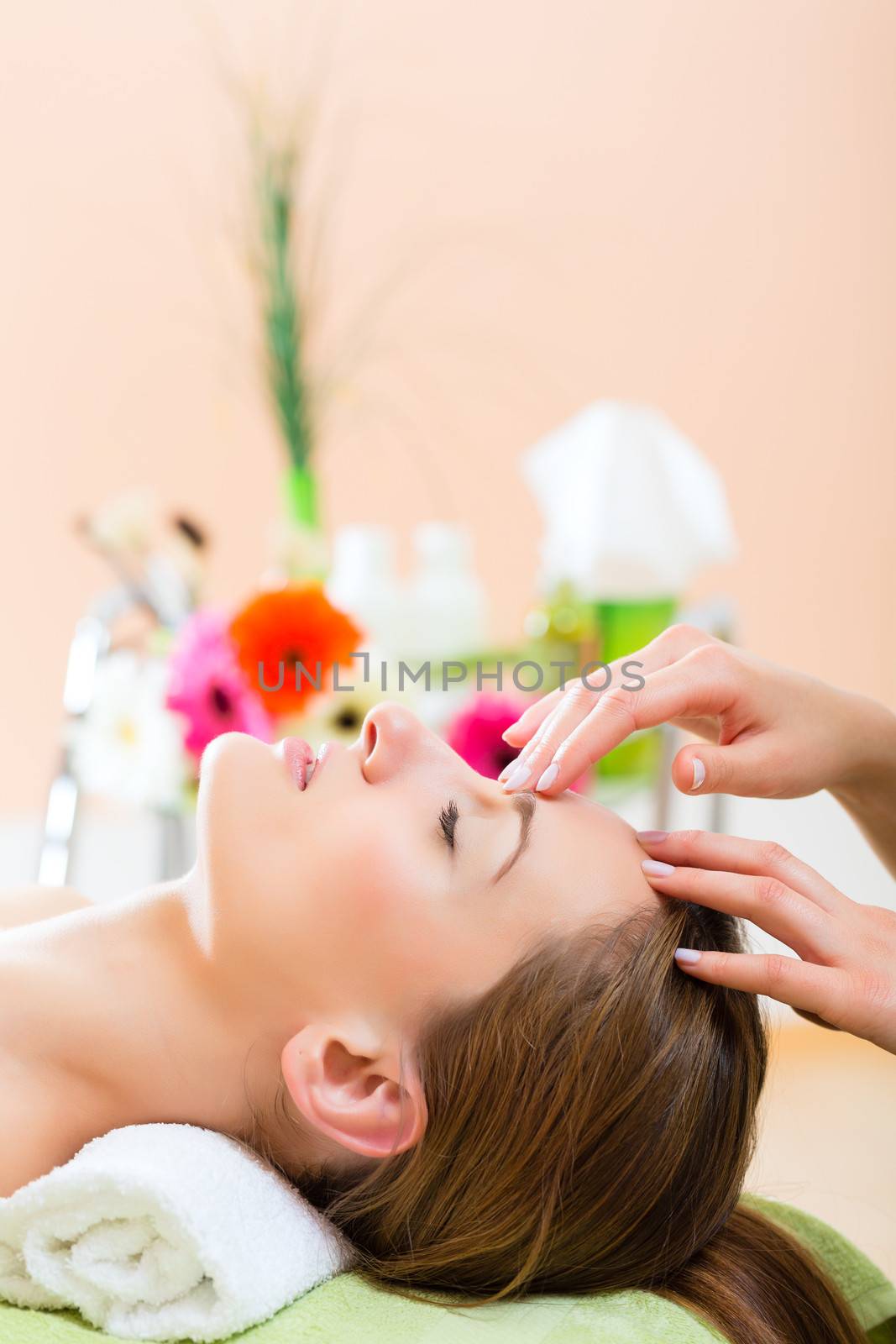 Wellness - woman getting head massage in Spa by Kzenon