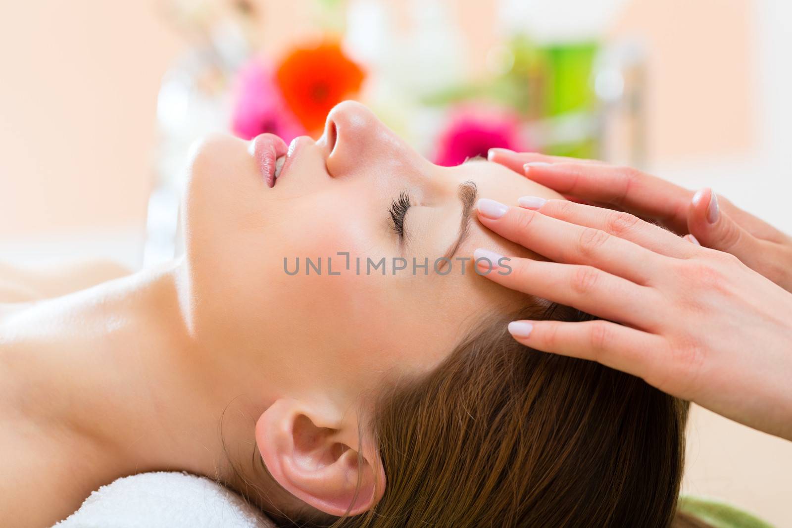 Wellness - woman getting head massage in Spa by Kzenon