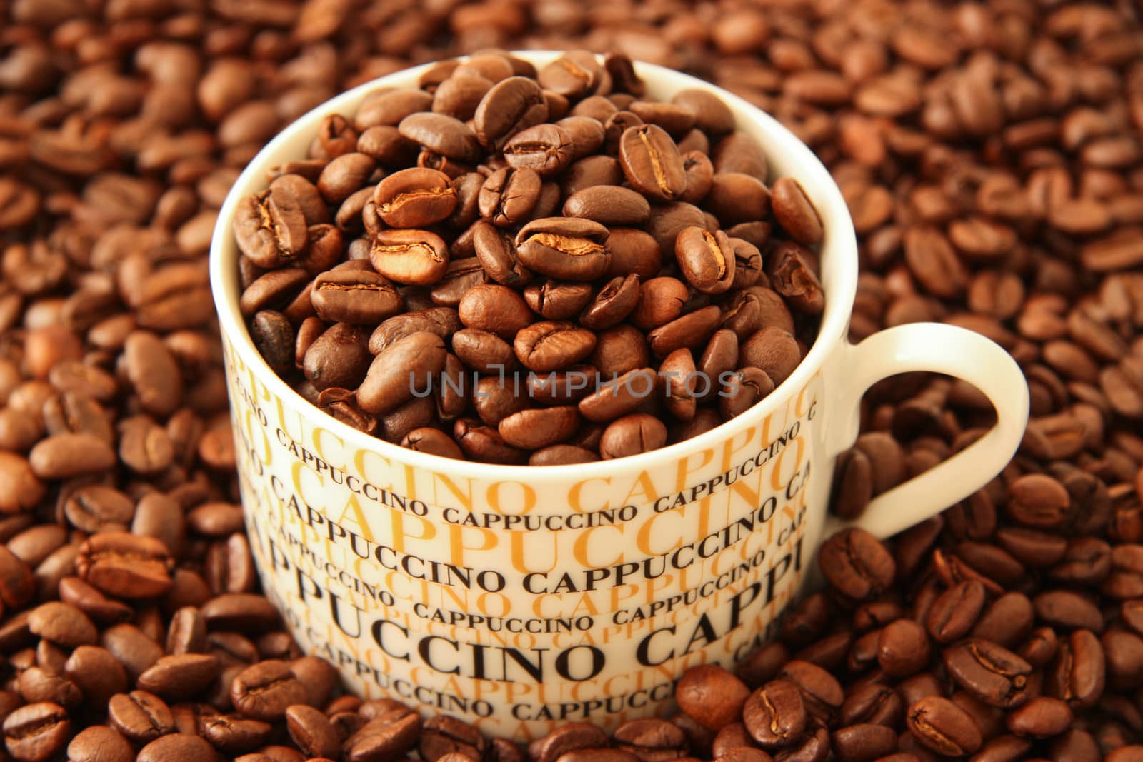 Coffee beans in a cappuccino cup