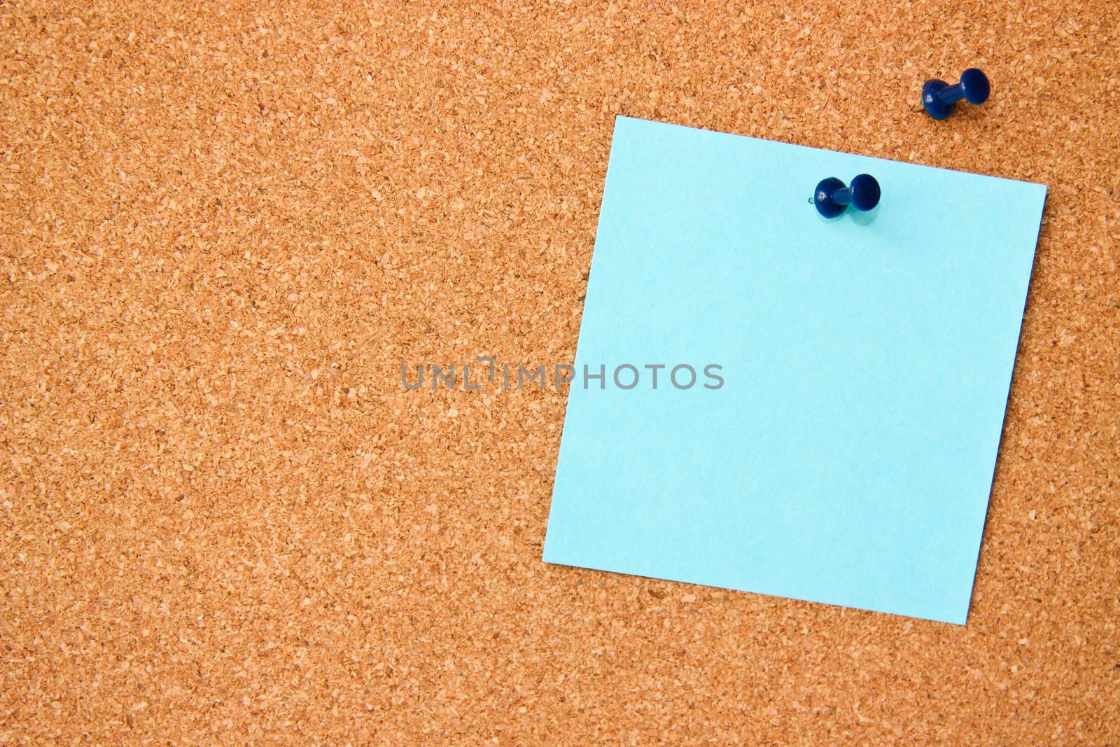 Corkboard with blue note