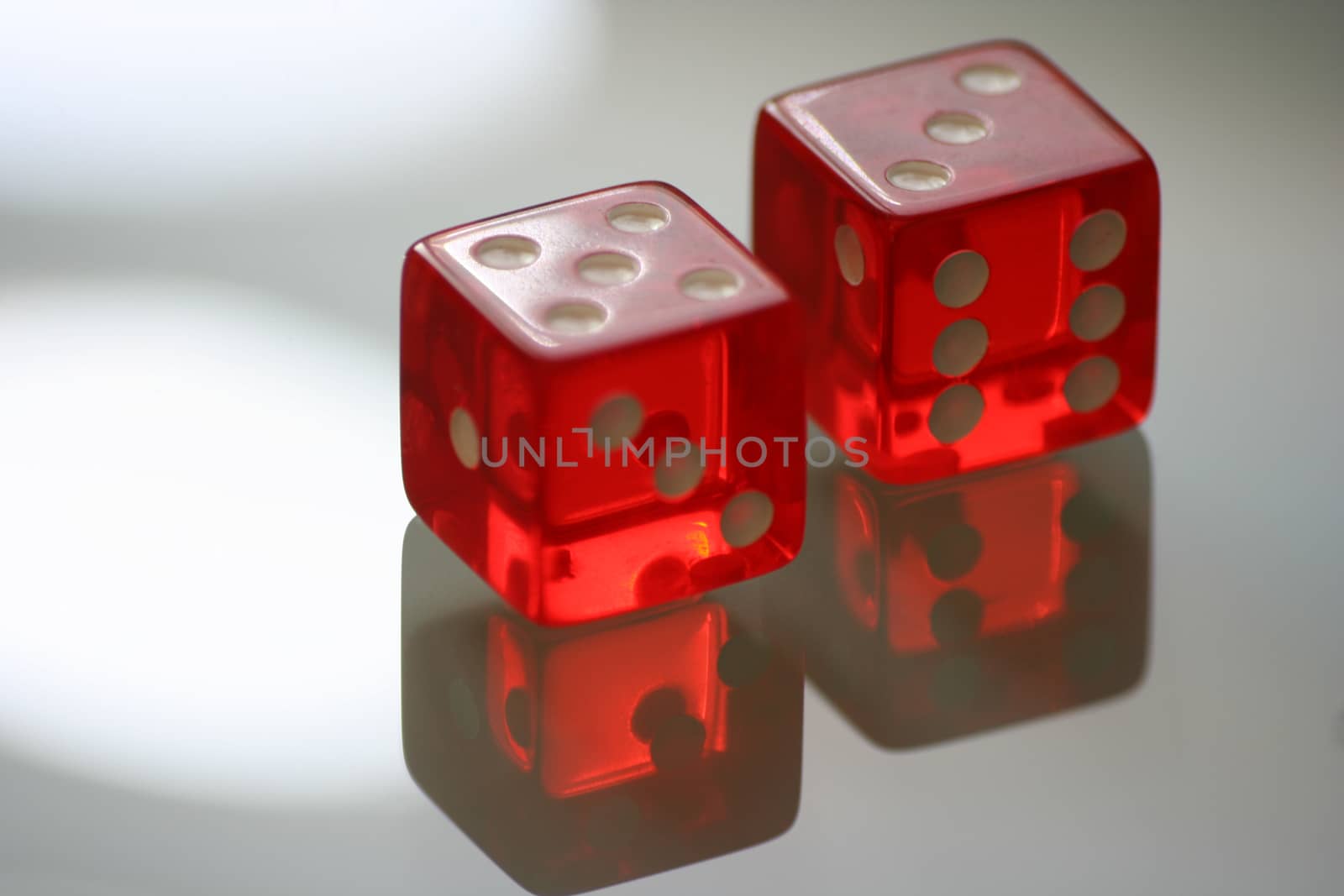 Red dice with reflection