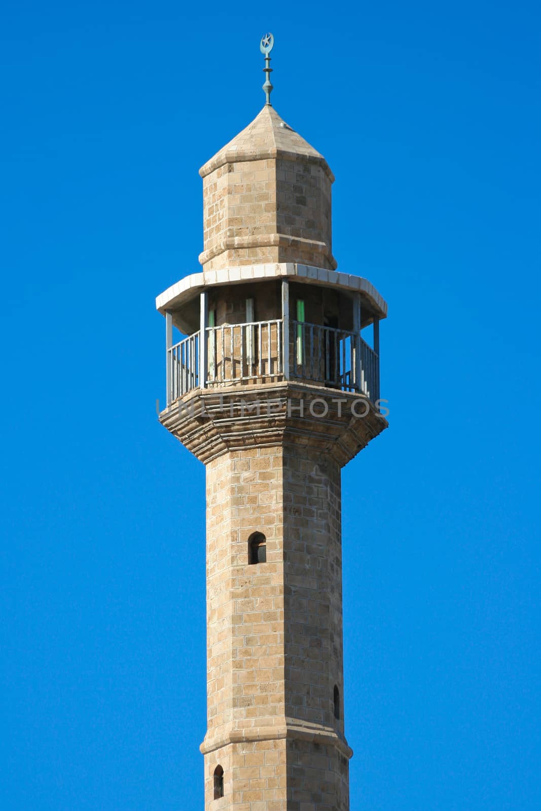 Mosque tower on blue sky background