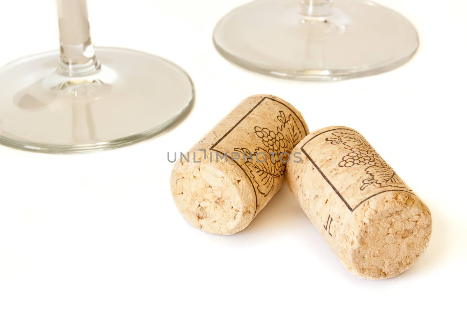 Wine cork and two wine glasses isolated on white background