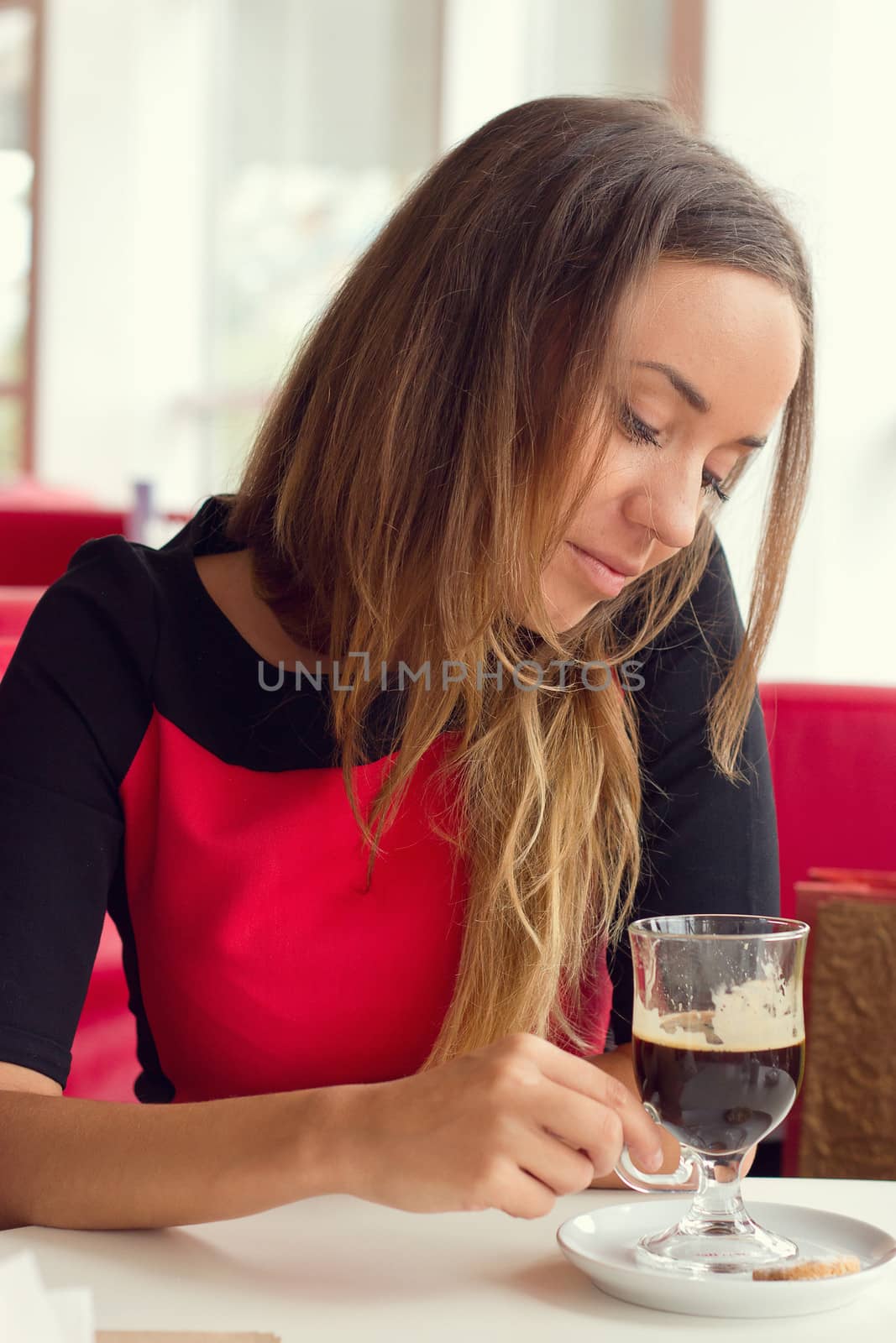 woman drinking coffee in the morning at restaurant