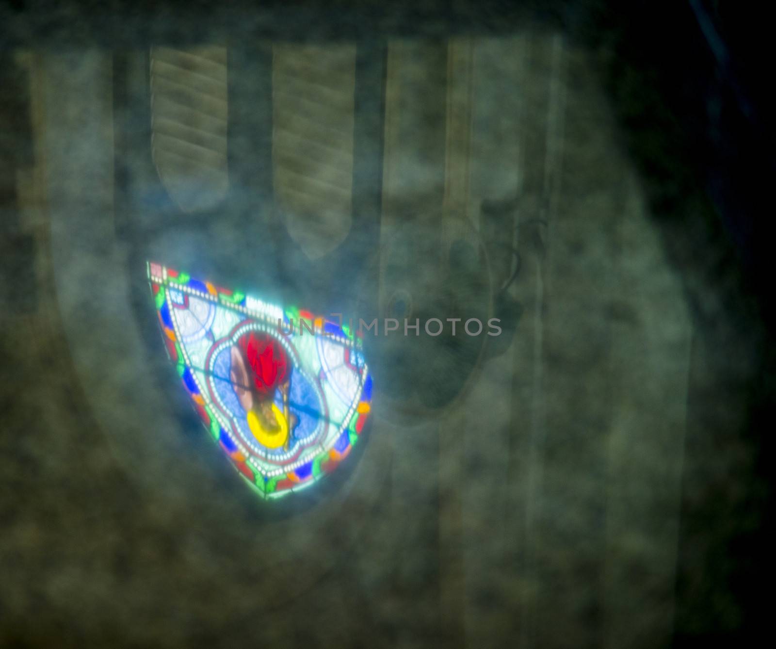 Reflect of Mosaic window on the floor by gjeerawut