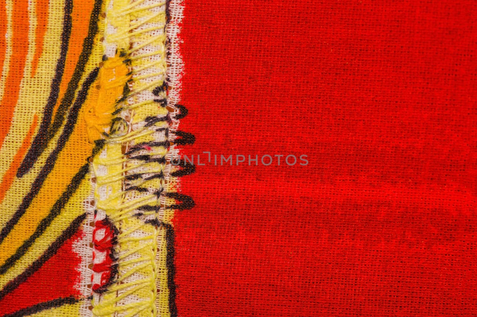 Sewn cloth background in orange yellow and red