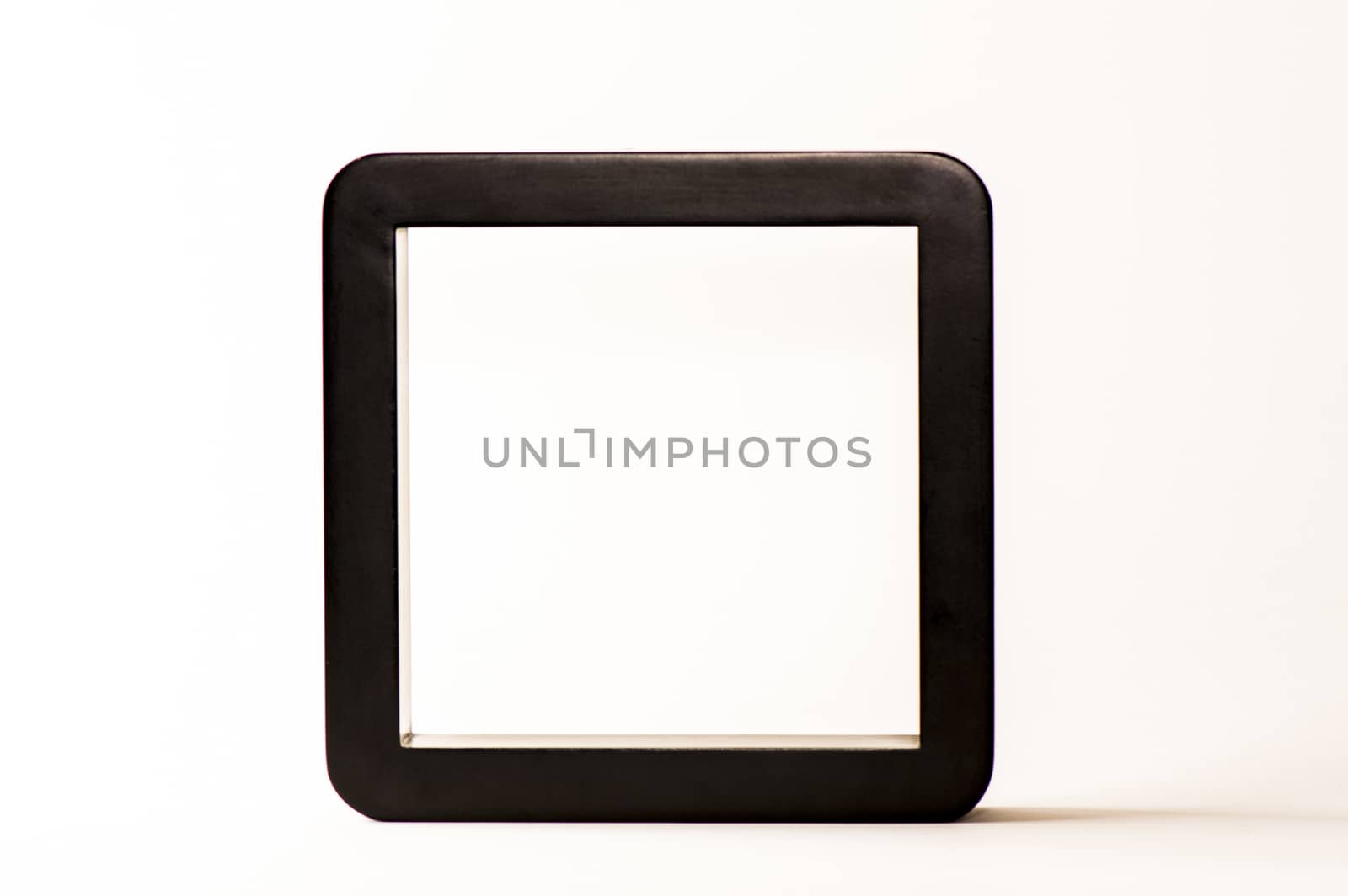 Empty black frame on white background seen from one side