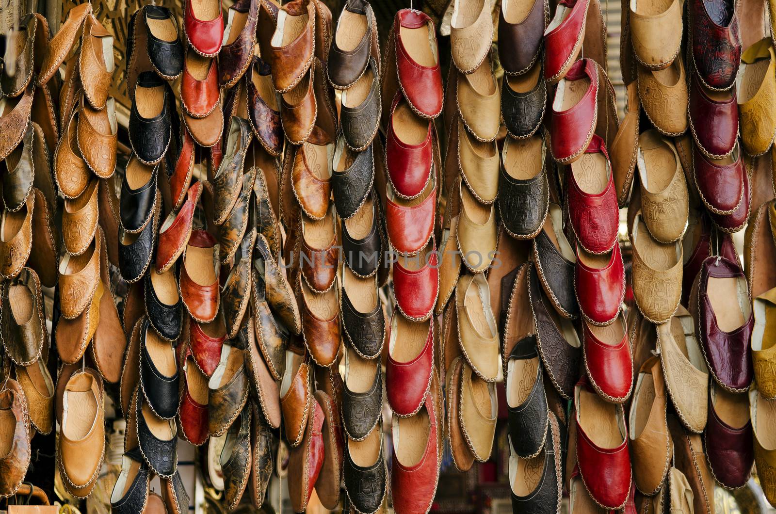 leather slippers in souk of cairo in egypt by jackmalipan