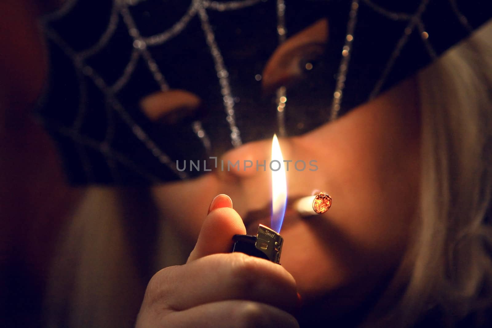 The Woman in a Mask gets a light cigarette  by cococinema