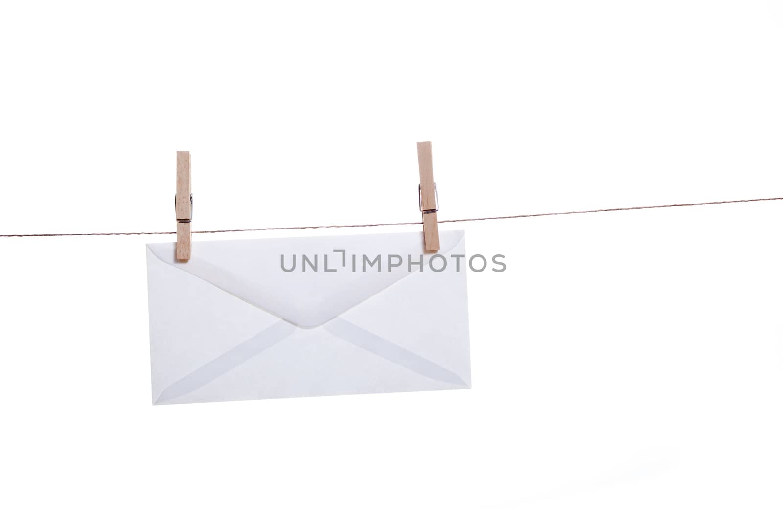 Envelope held by clothespins on a string