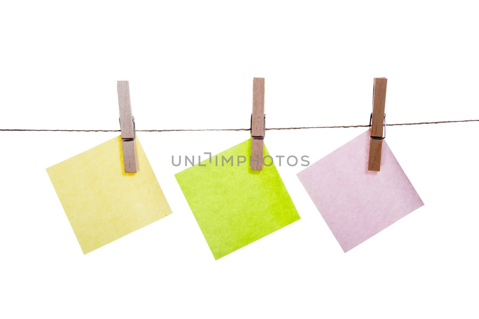 Blank paper cards hanging on clothespins