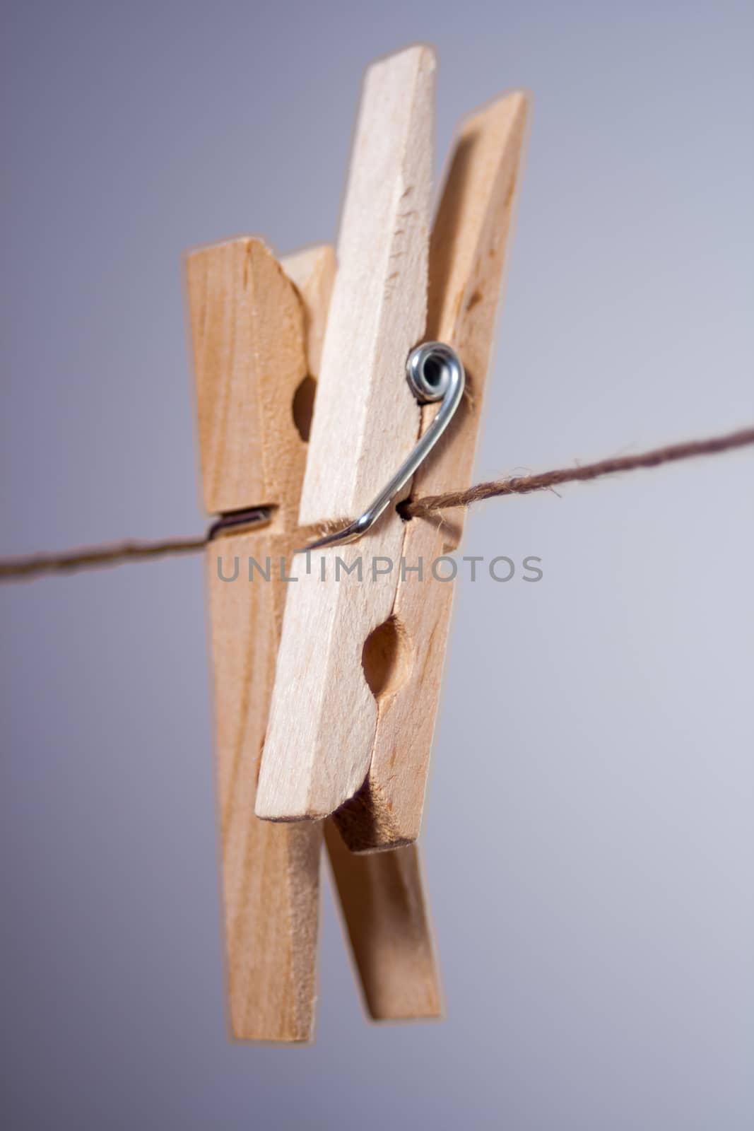 Two clothespins on a string