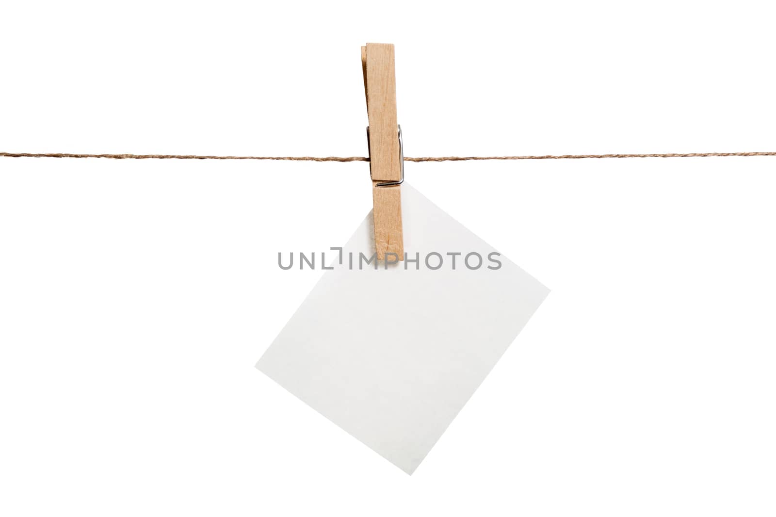 Close up of a note and a clothespin on white background