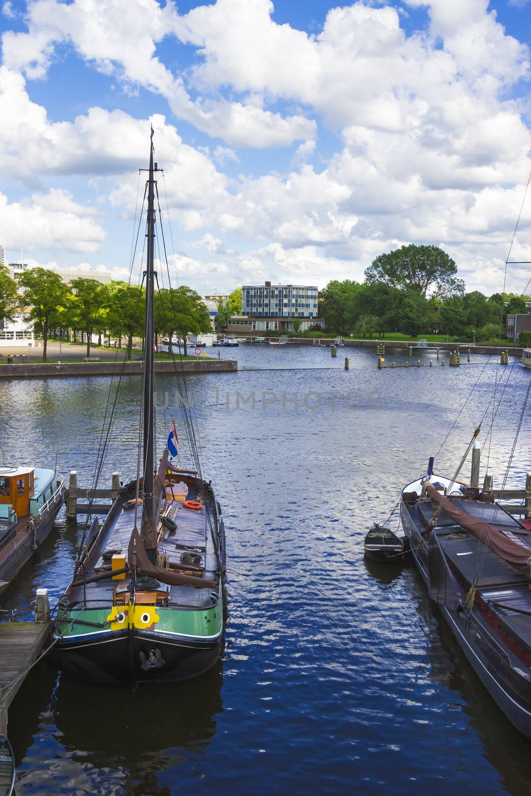 many ships parked near the shore in Amsterdam