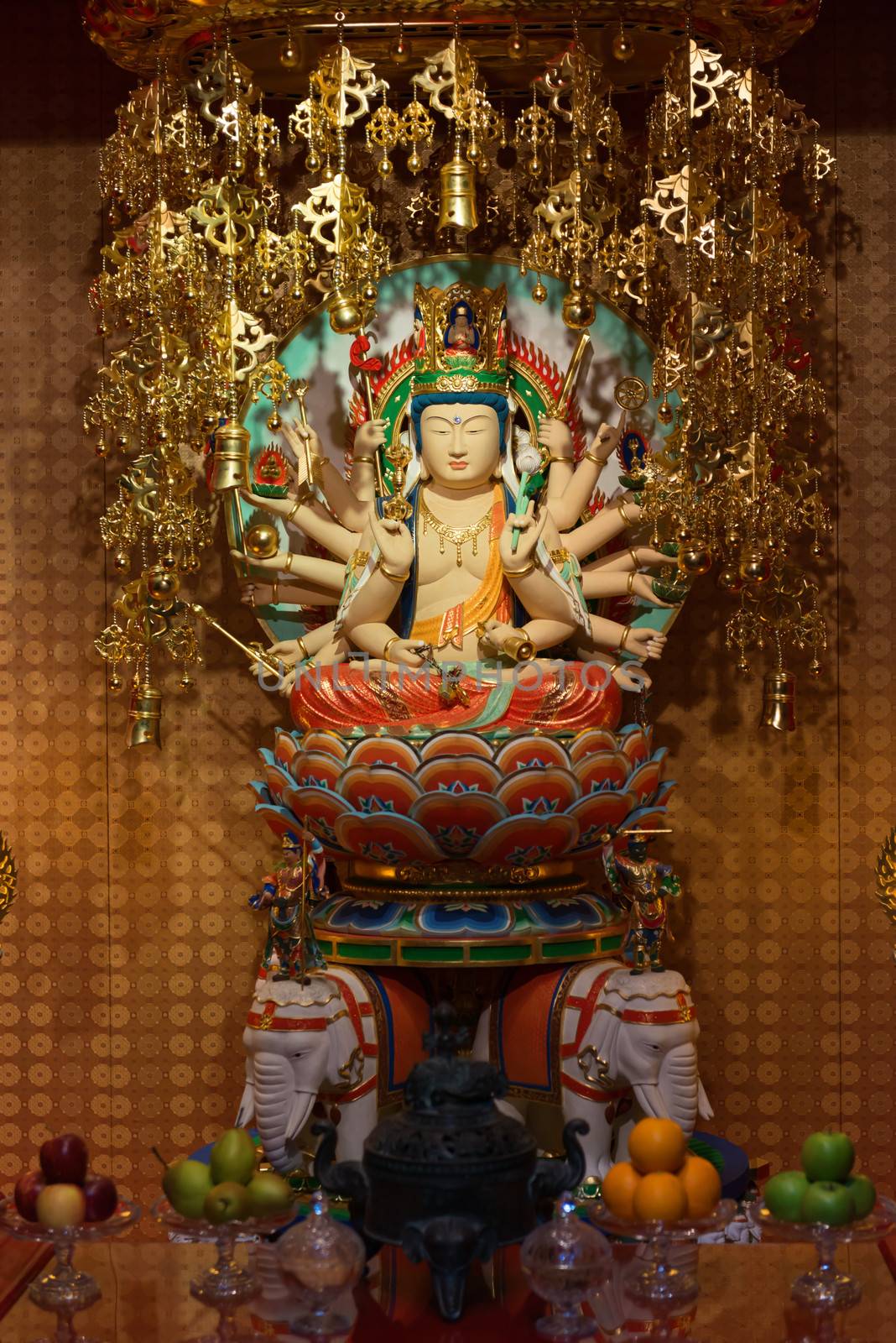 Buddha in Tooth Relic Temple interior in China Town, Singapore 