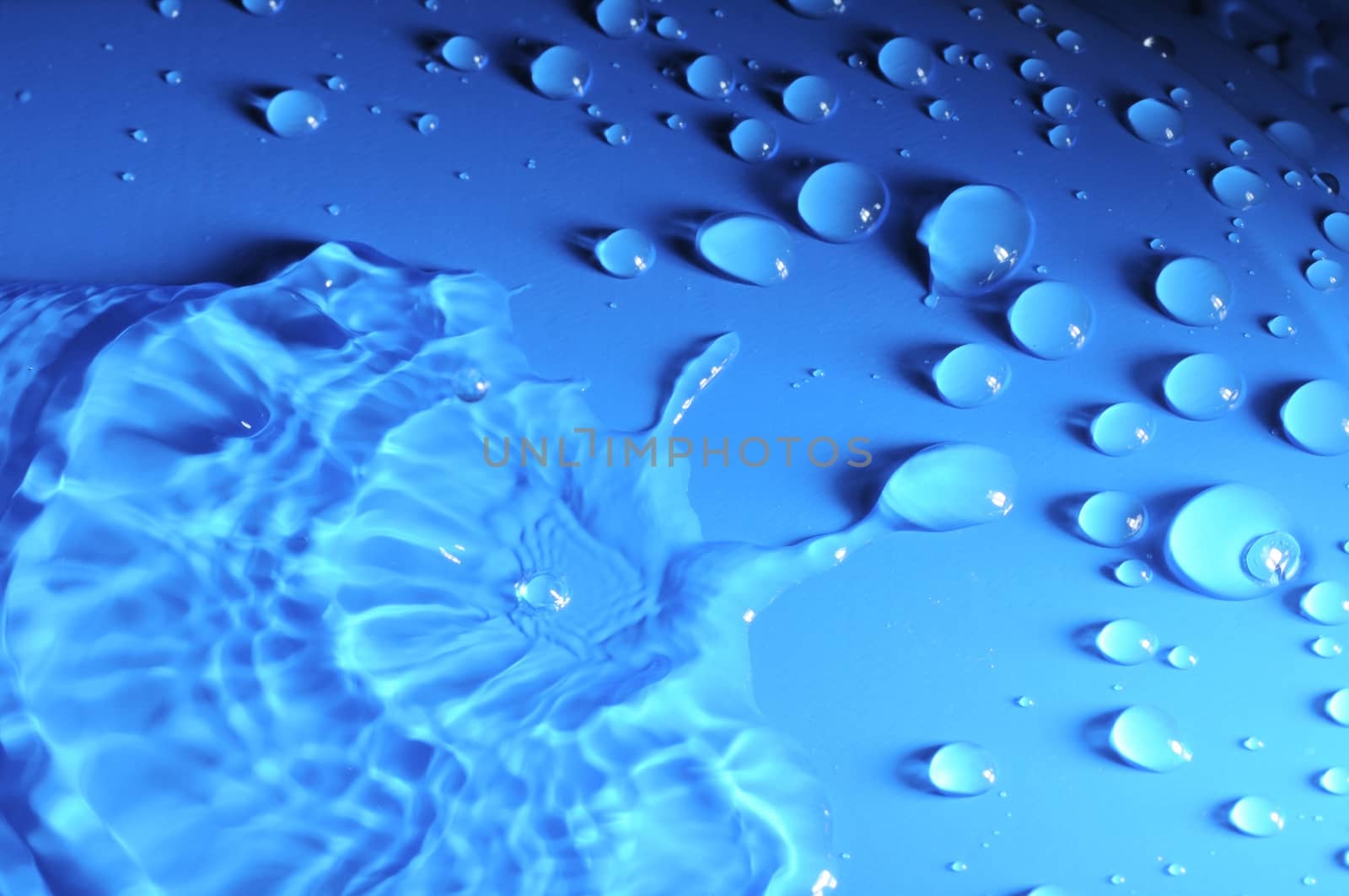 Some Water Drops on a Blue Textured Background
