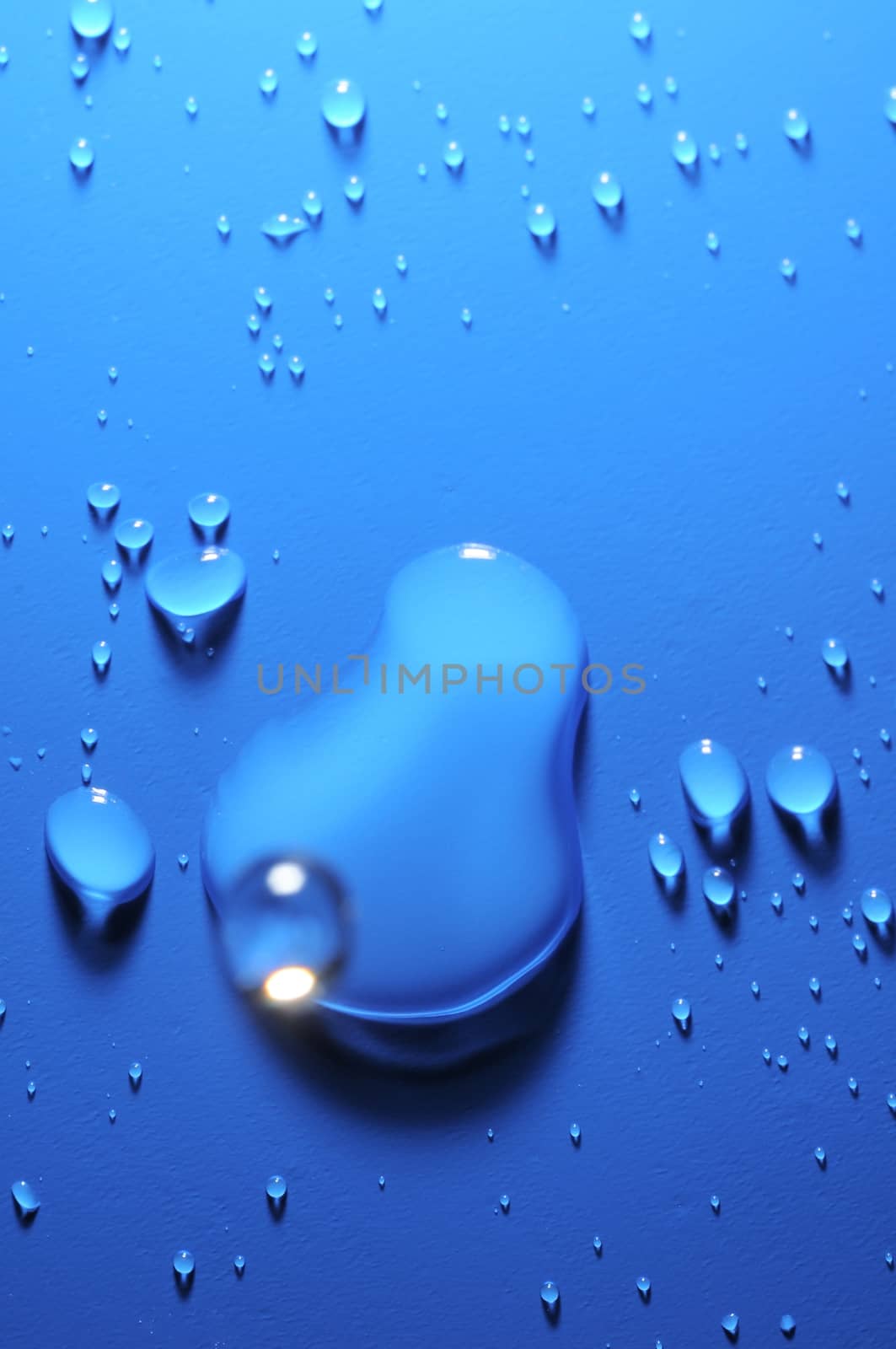 Some Water Drops on a Blue Textured Background