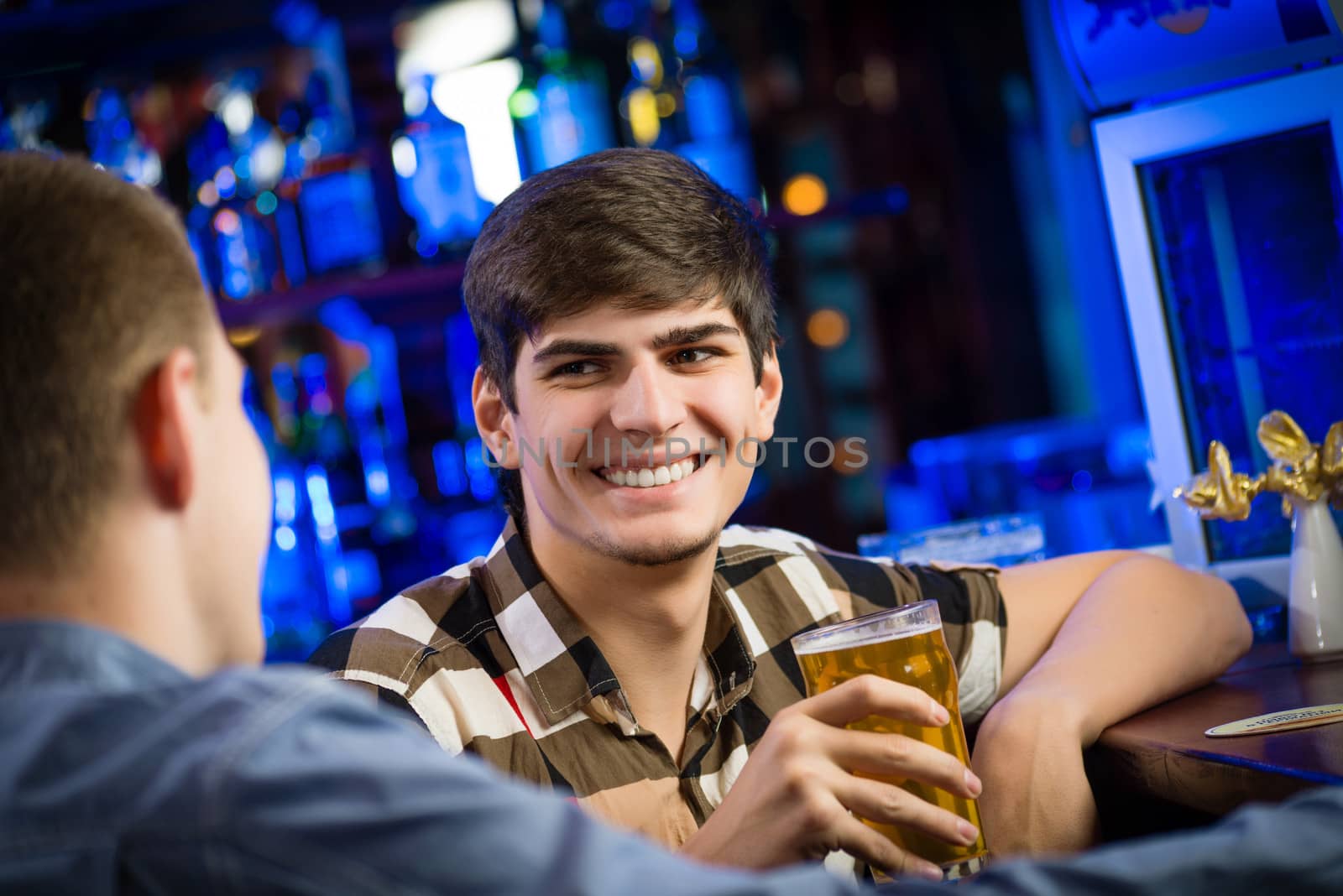 portrait of a young man at the bar, fun nightlife