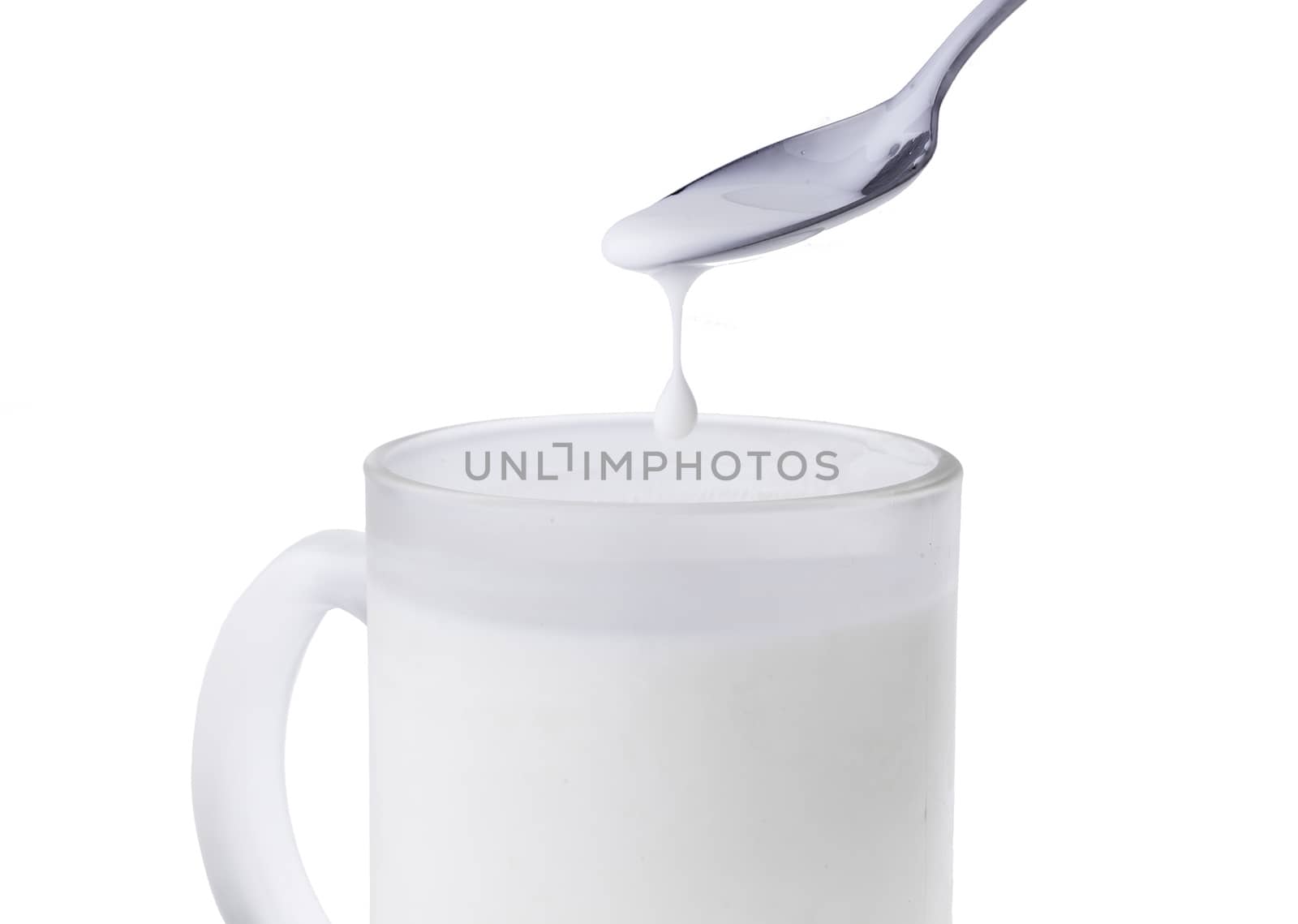 Cup of milk with spoon by tdhster