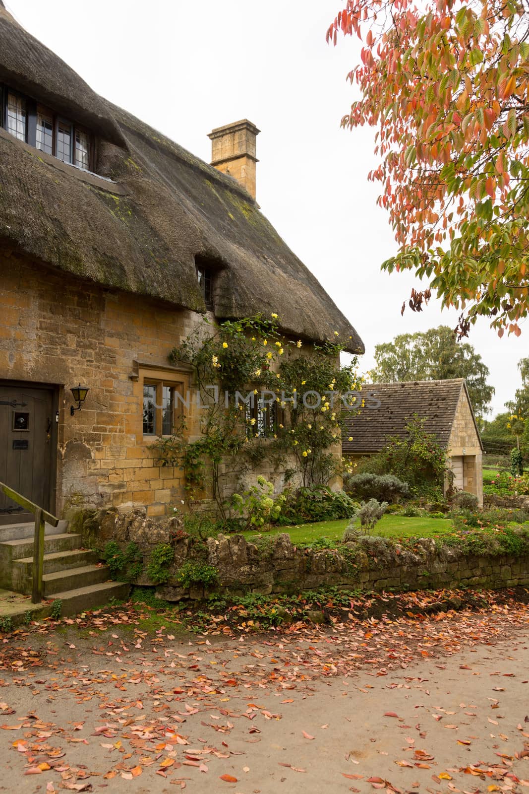 Thatched cottage in Stanton in Cotswold or Cotswolds district of southern England in the autumn.