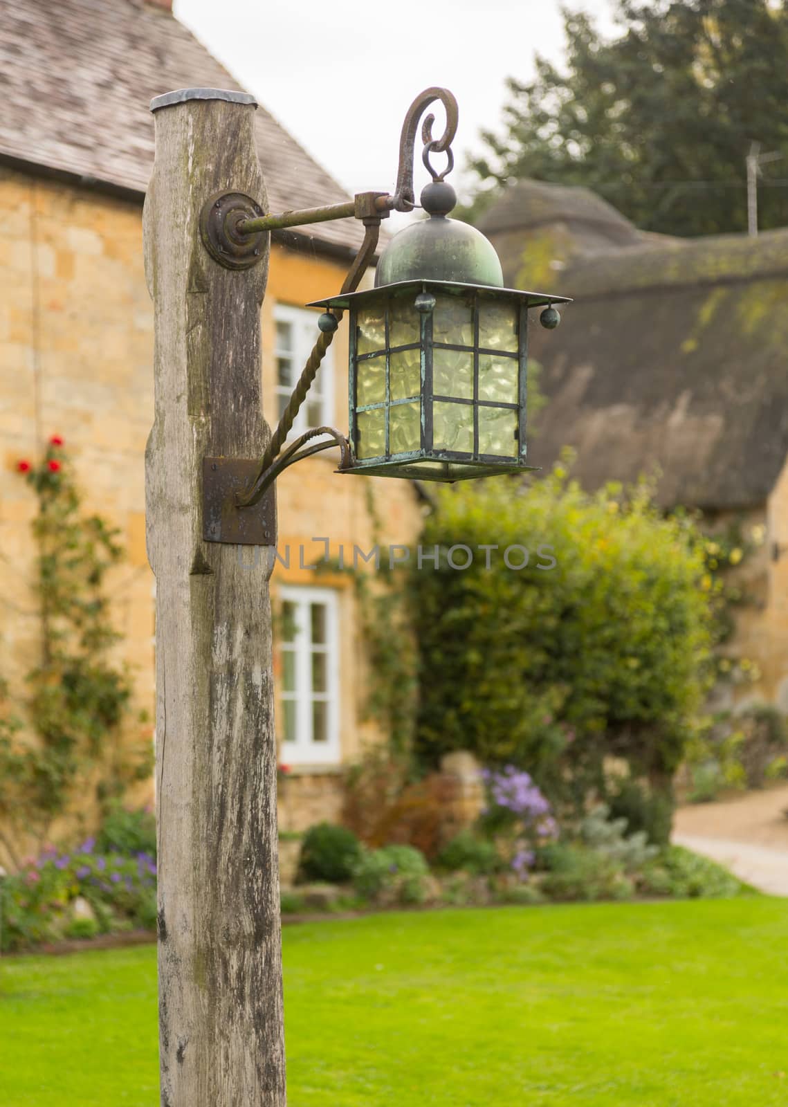 Street lamp in the village of Stanton near Stanway. Cotswold or Cotswolds district of southern England in the autumn.