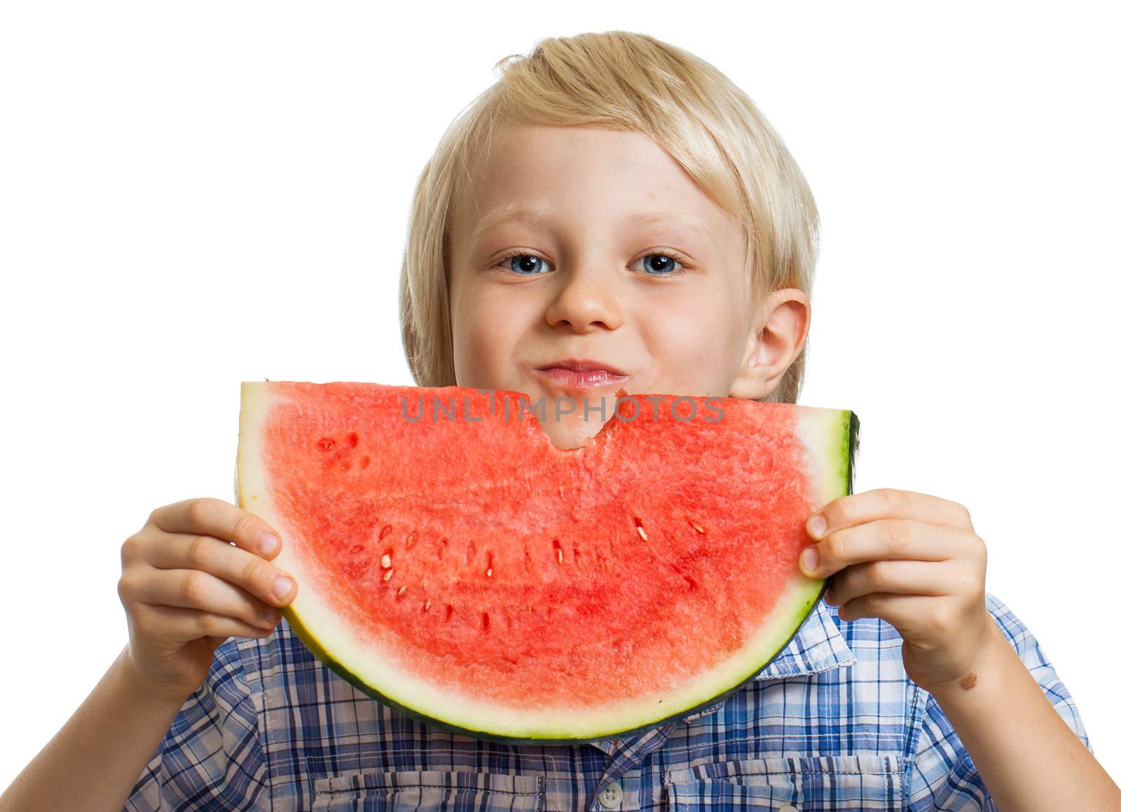 A cute happy smiling boy eating a juicy slice of watermelon. Isolated on white.