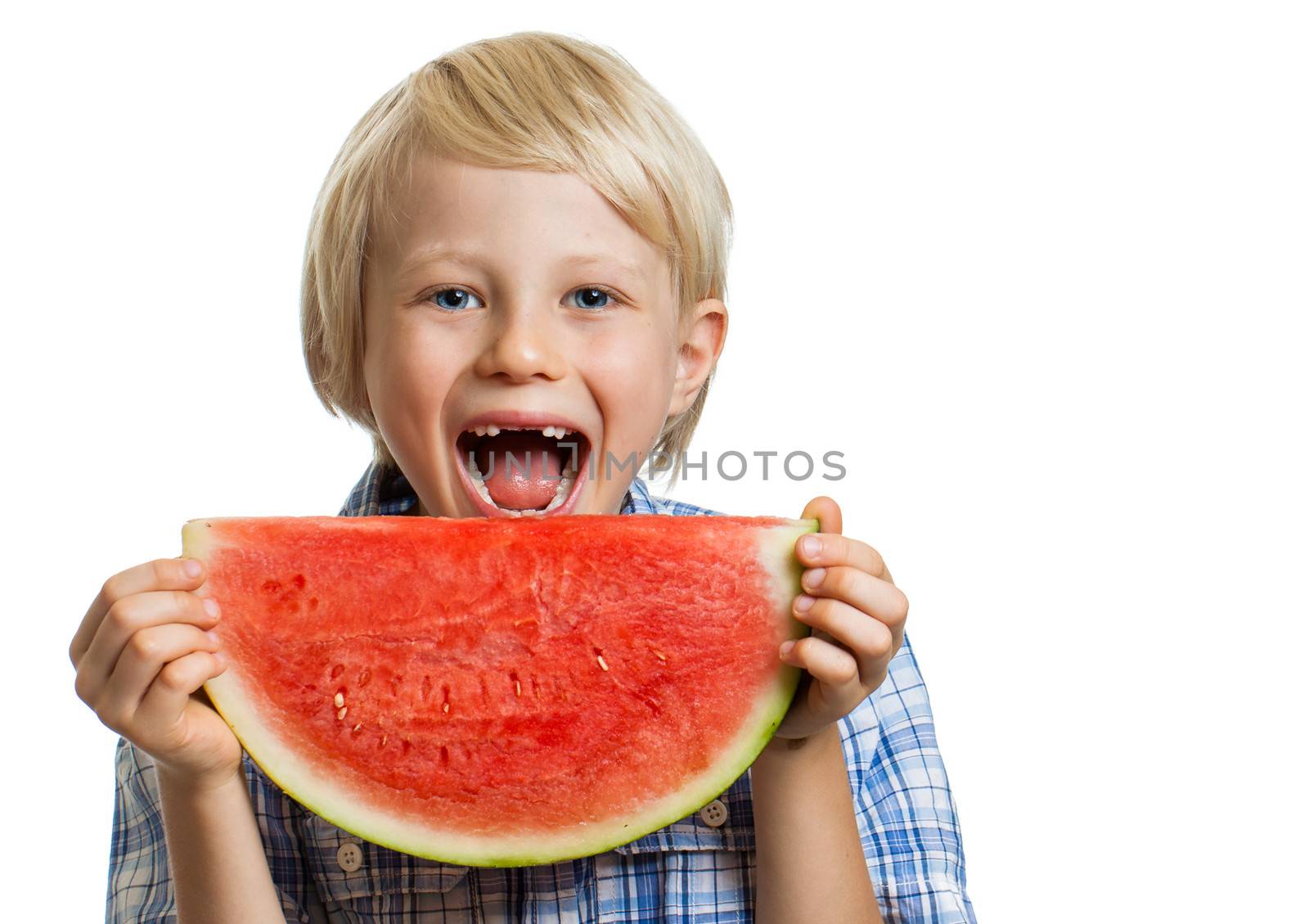 A smiling happy boy about to take a bite of  juicy slice of watermelon. Isolated on white.