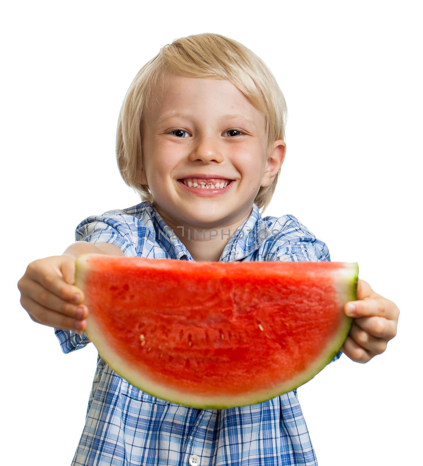Close-up of cute happy smiling boy holding out a big juicy slice of watermelon. Isolated on white.
